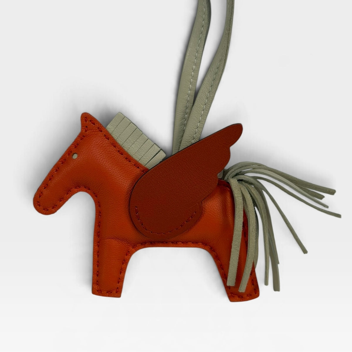 Hermès Rodeo Pegasus Charm In Orange Poppy, Craie & Terre Battue. 100% authentic and pre loved in excellent condition.