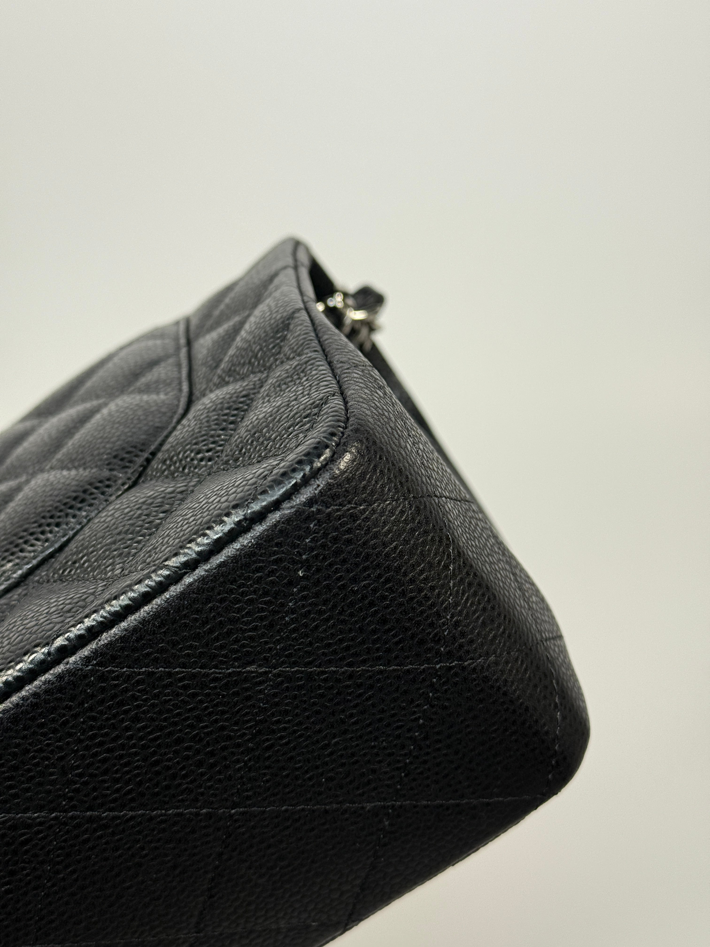 Chanel Classic Jumbo Flap Bag In Black Caviar Leather With Silver Hardware. Authentic and preloved. Excellent condition.