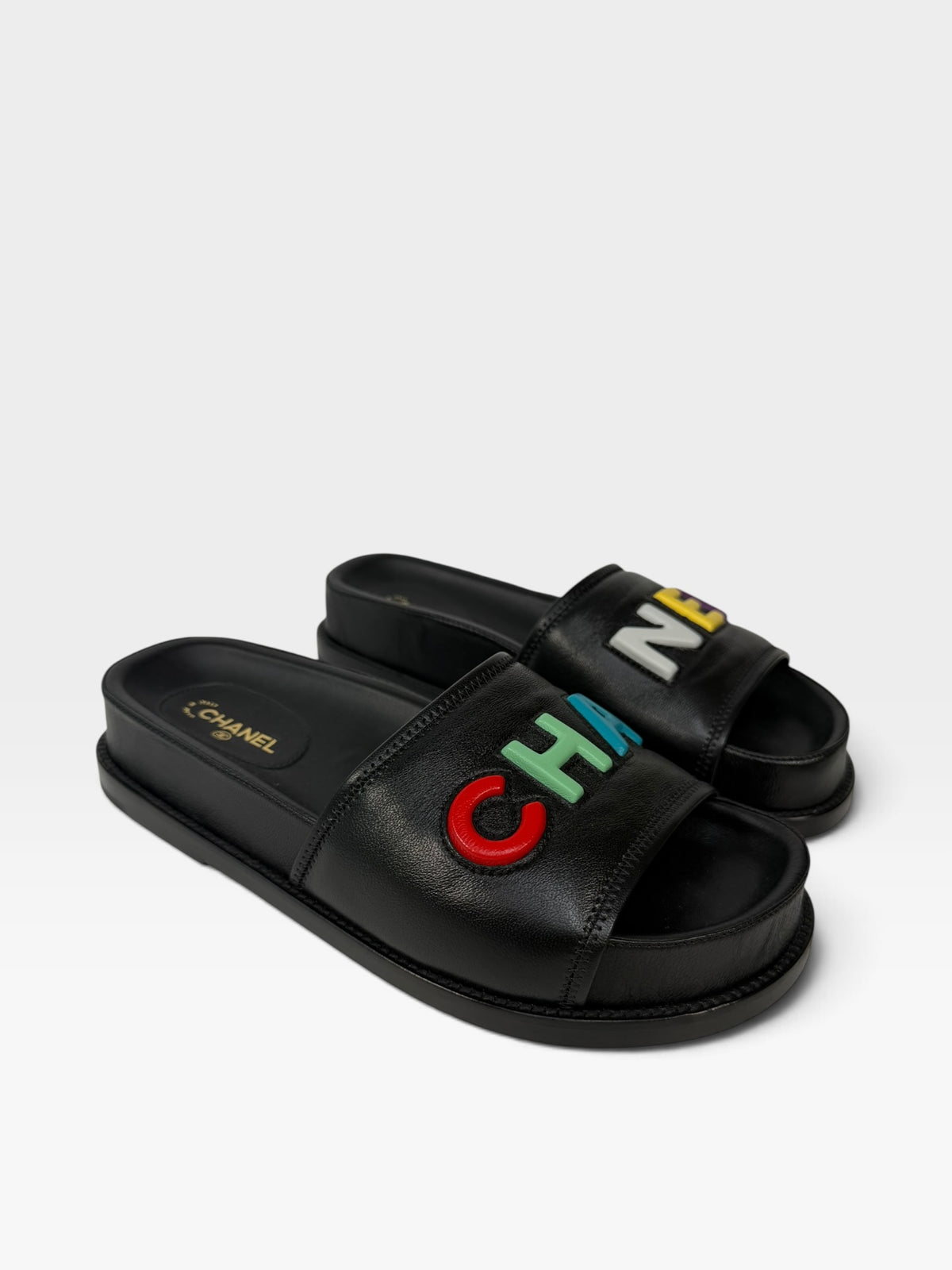 Chanel Multicolour Logo Slide Sandals In Black Leather. 100% authentic and preloved in excellent condition
