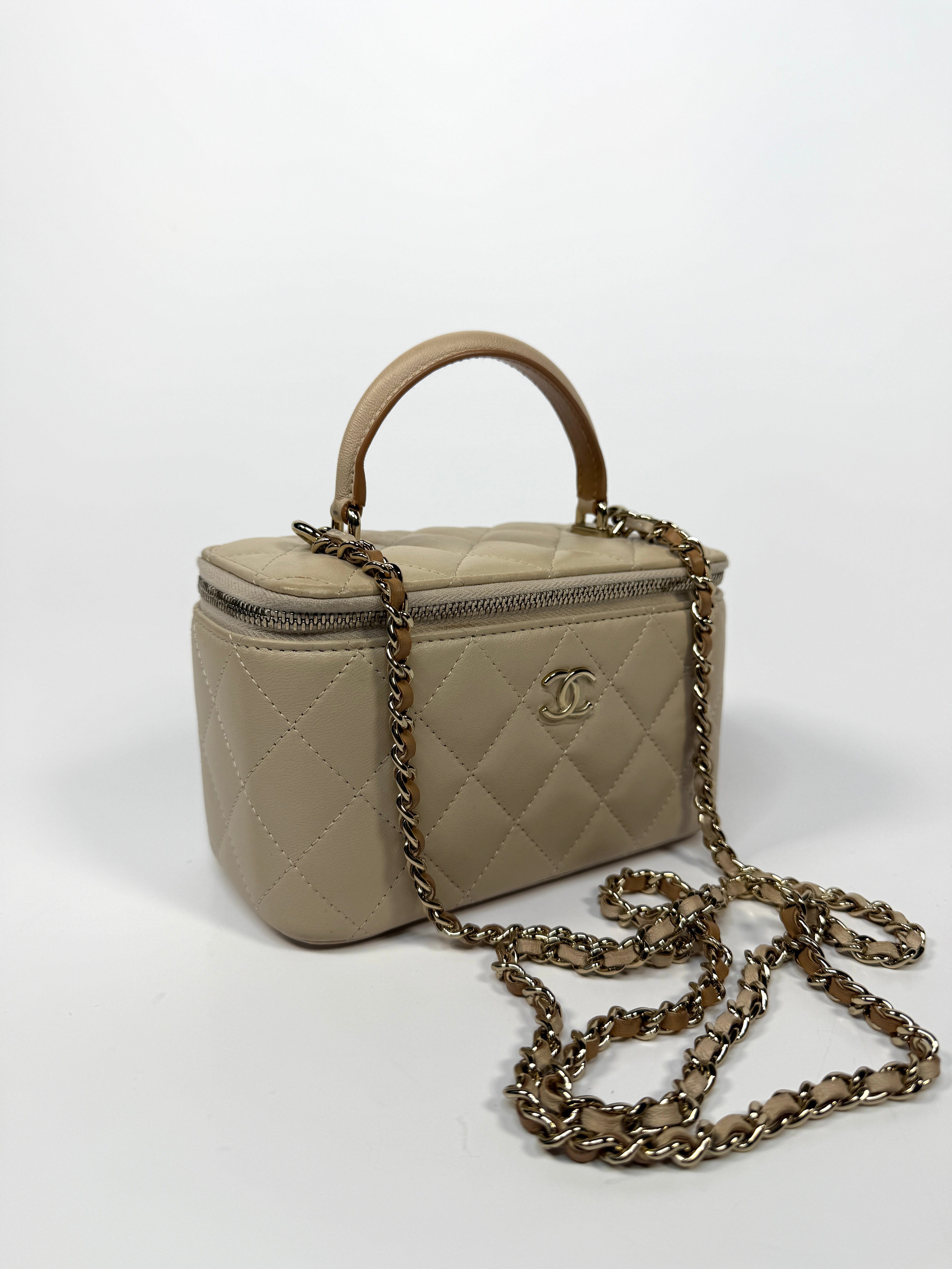 Chanel Vanity Rectangular Top Handle Ecru/Beige Lambskin With Gold Hardware Authentic and preloved. Excellent condition.