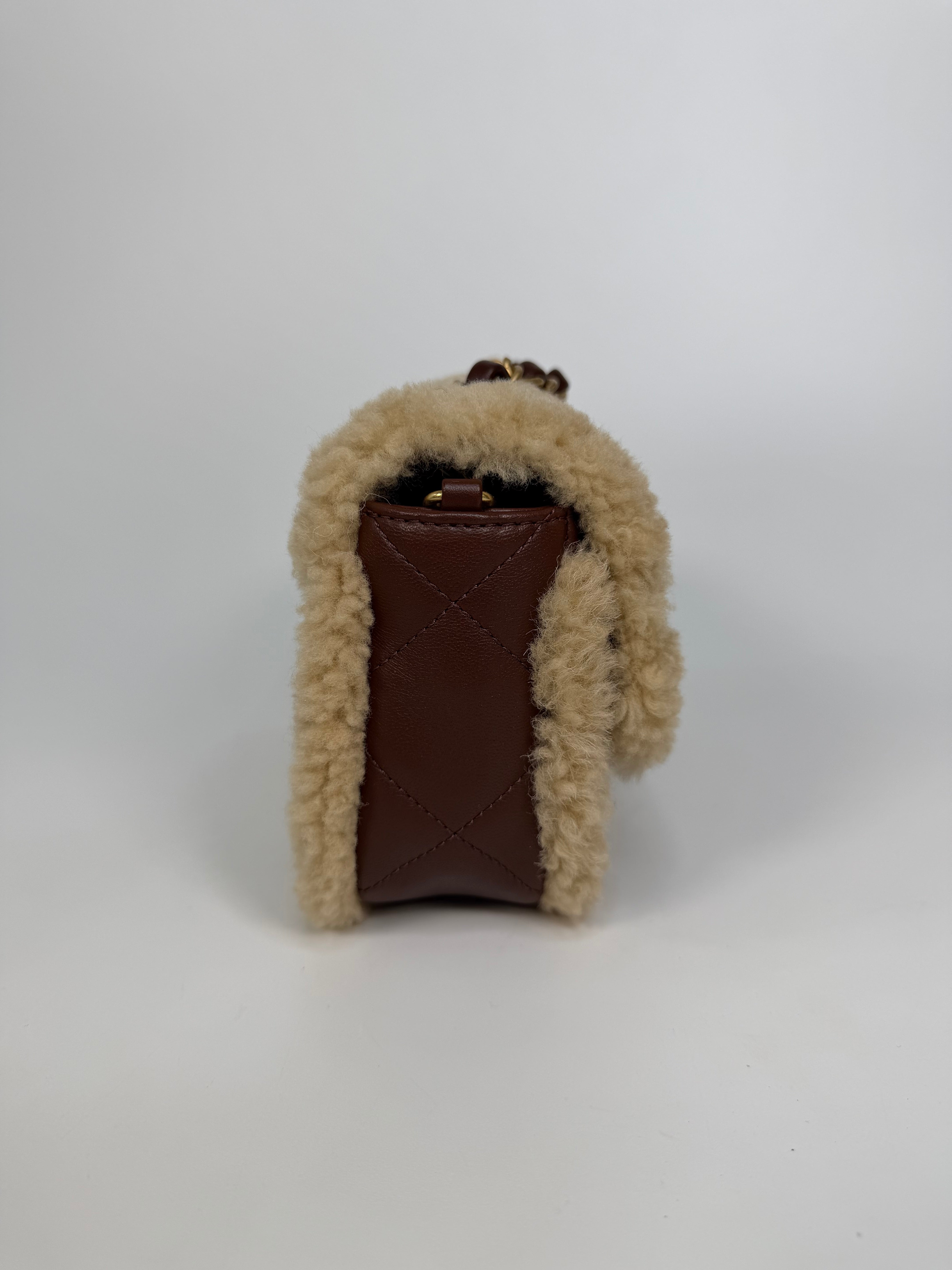 Chanel Mini Rectangle In Brown Lambskin Leather & Shearling With Gold Hardware. Authentic and preloved in excellent condition with 100% authenticity guarantee.