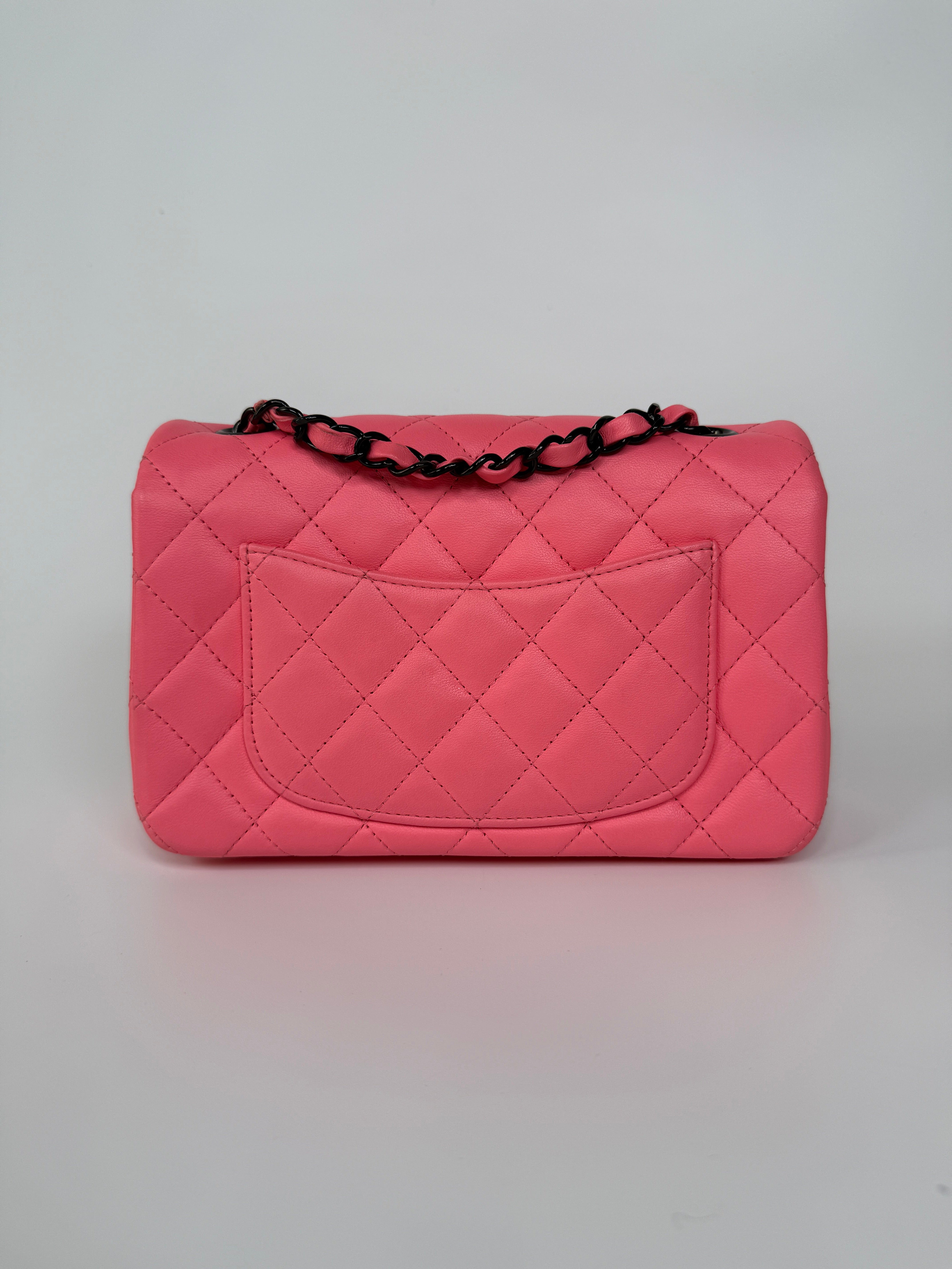 Chanel Mini Rectangle Flap Bag In Pink Lambskin With Black Hardware In Excellent Condition. Authentic and preloved.