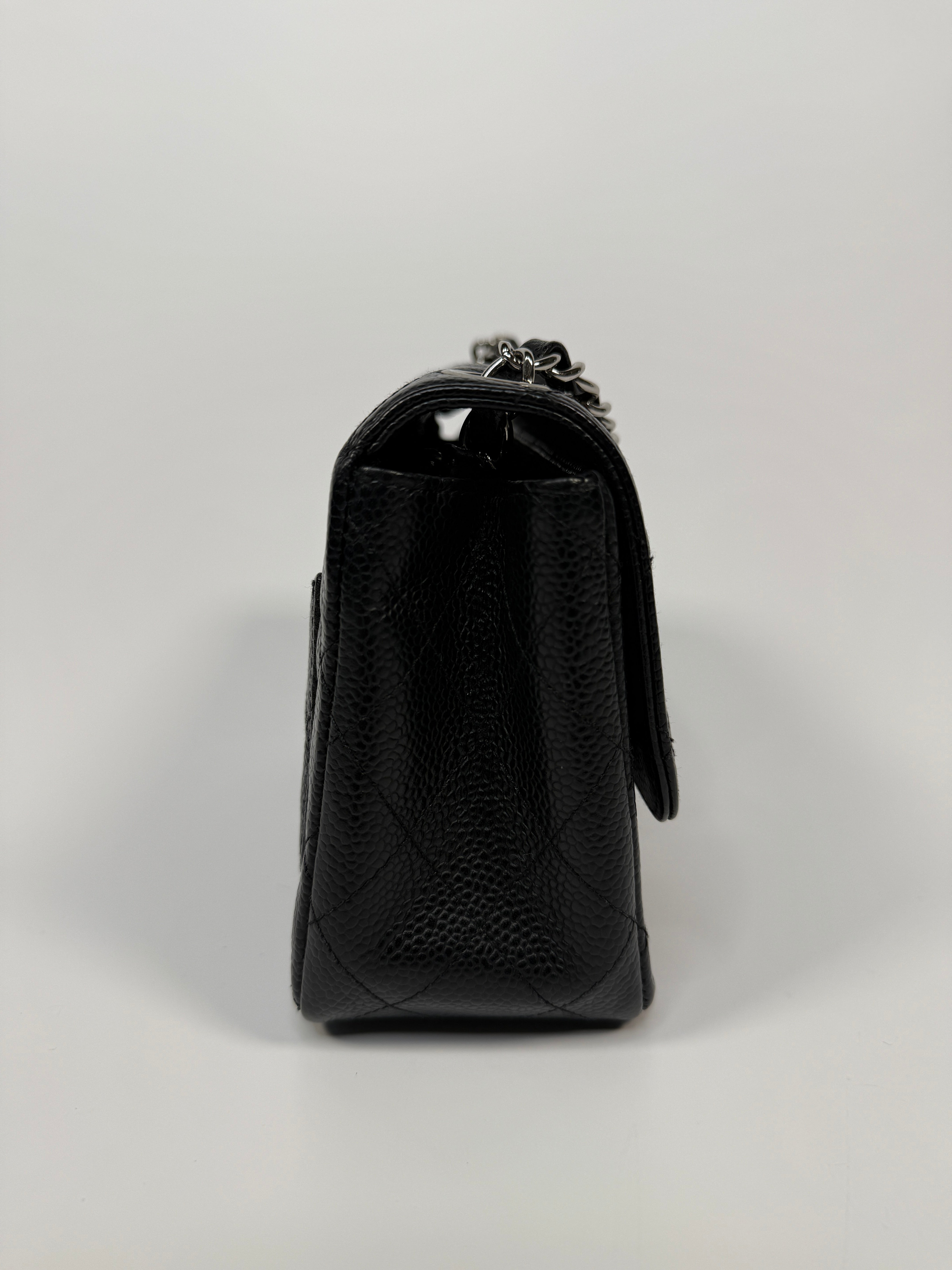 Chanel Black Square Flap Bag In Black Caviar Leather With Silver Hardware. Excellent condition. Authentic and preloved.
