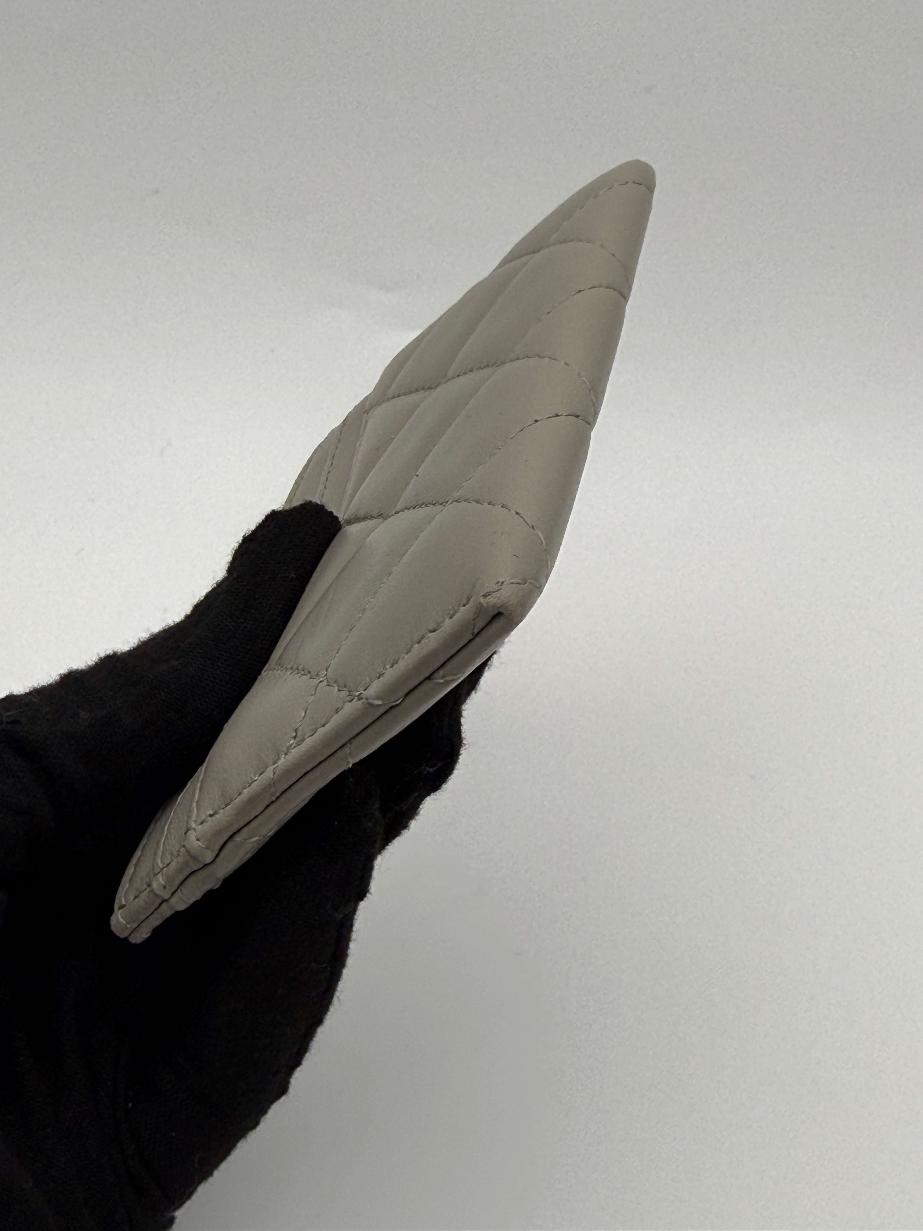 Authentic and pre loved Chanel Classic Card Holder In Grey Lambskin Leather With Silver hardware. Excellent Condition. 100% Authenticity guarantee.