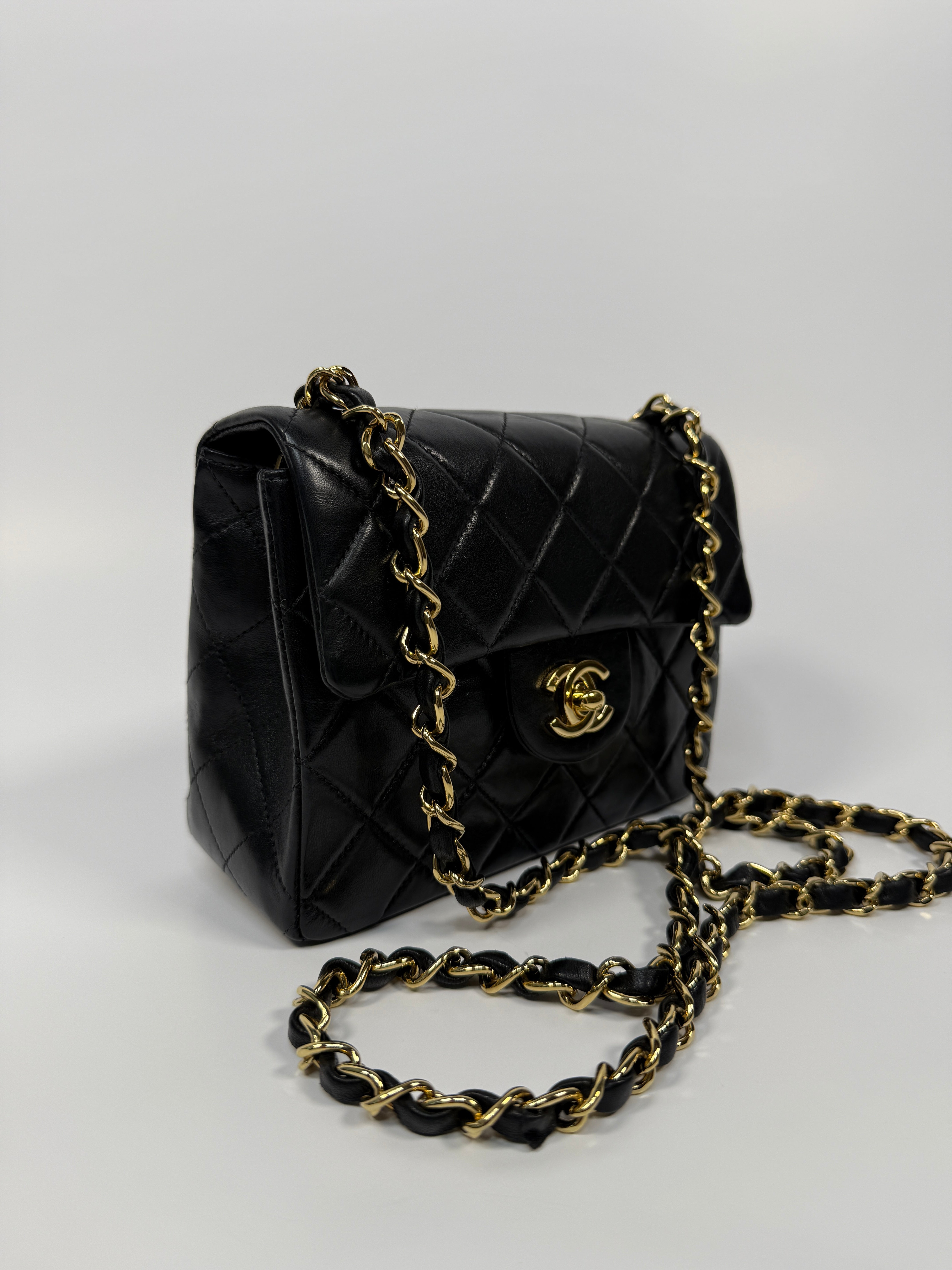 Chanel Black Square Vintage Flap Bag In Lambskin With Gold Hardware
Pre Loved & Authentic