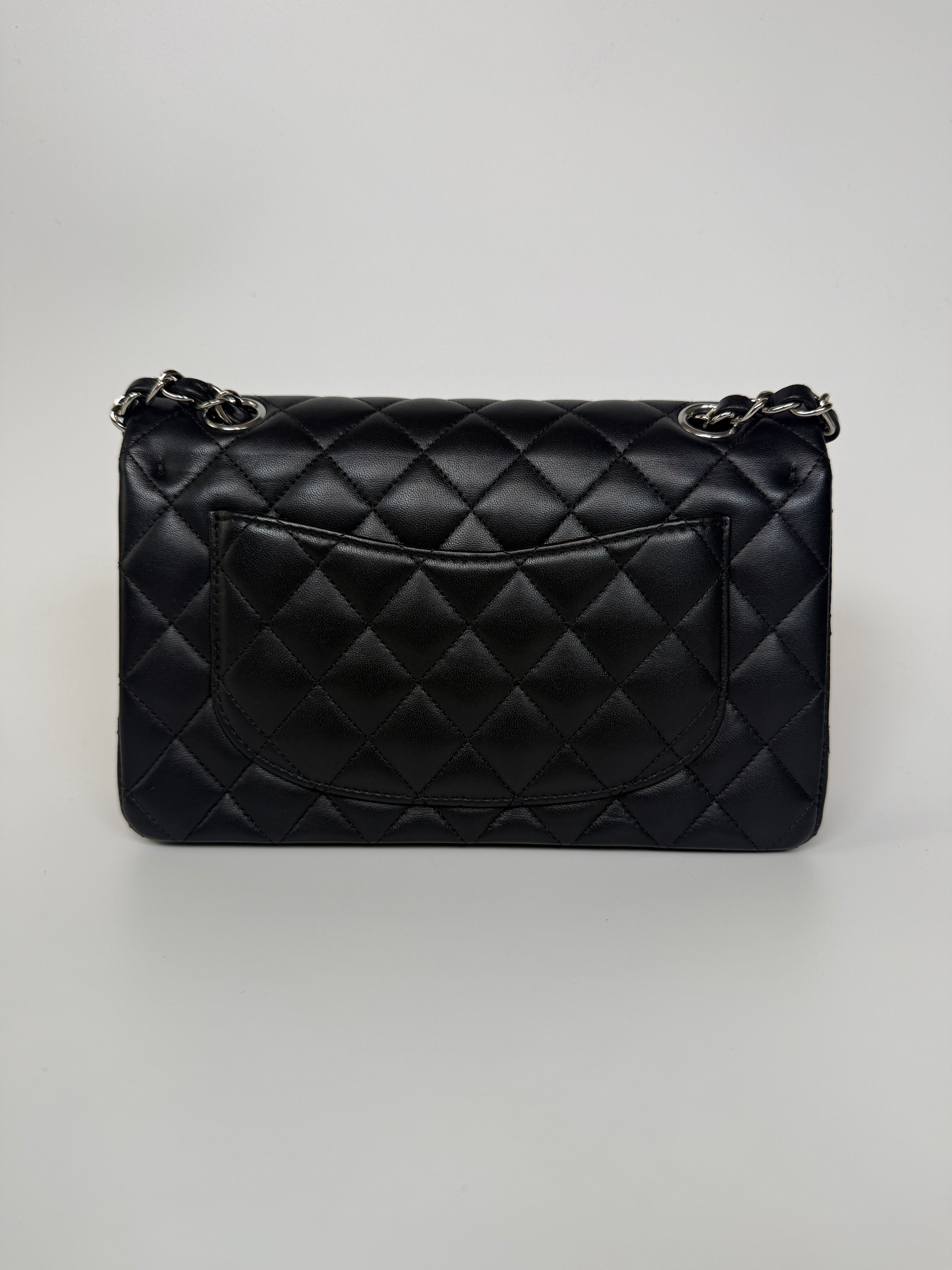 Authentic and preloved Chanel Small Classic Double Flap In Black Lambskin Leather With Silver hardware 100% Authenticity guarantee