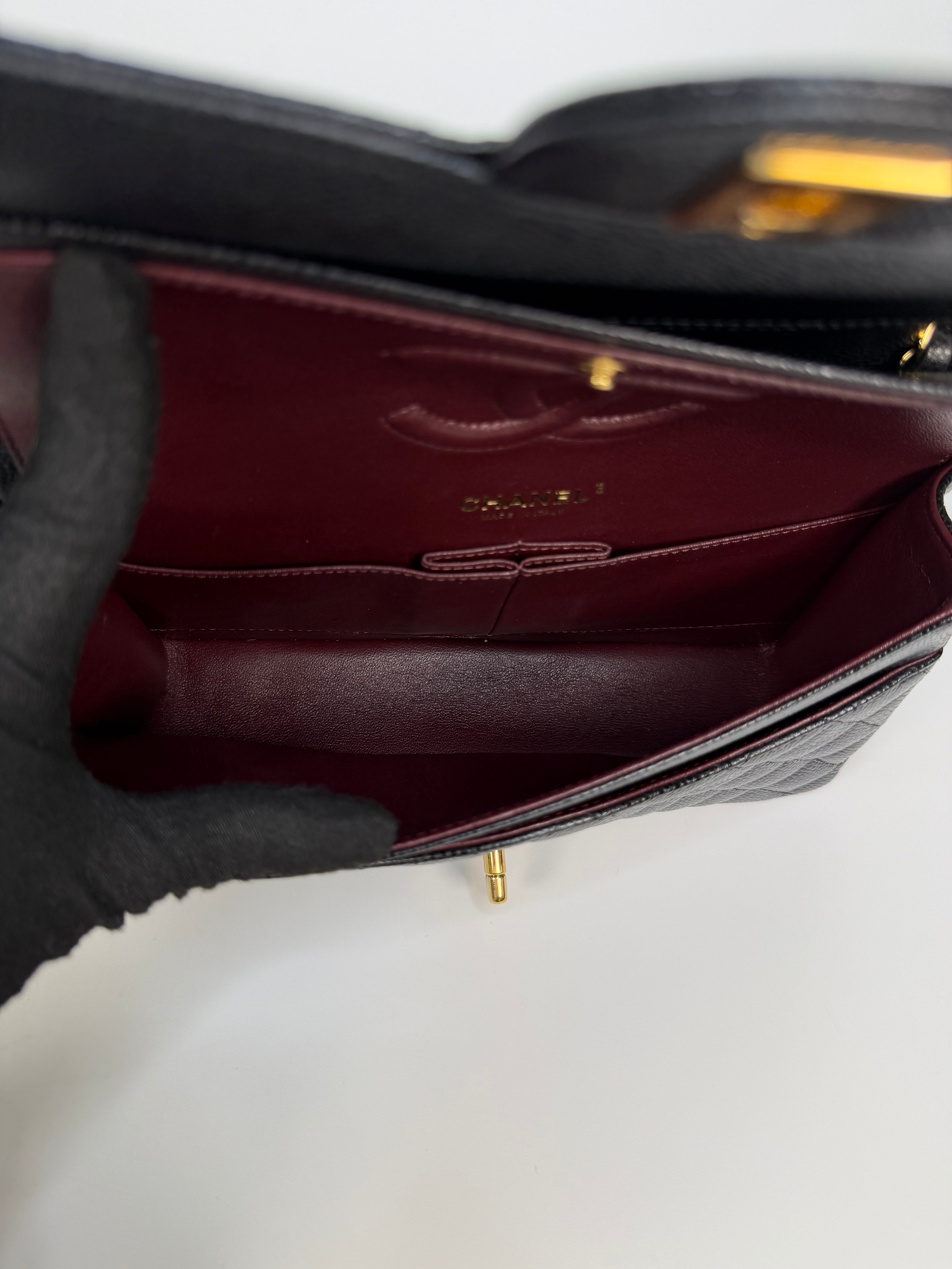 Chanel Medium Classic Double Flap In Black Caviar With Gold Hardware. Authentic and preloved in new and unused condition.