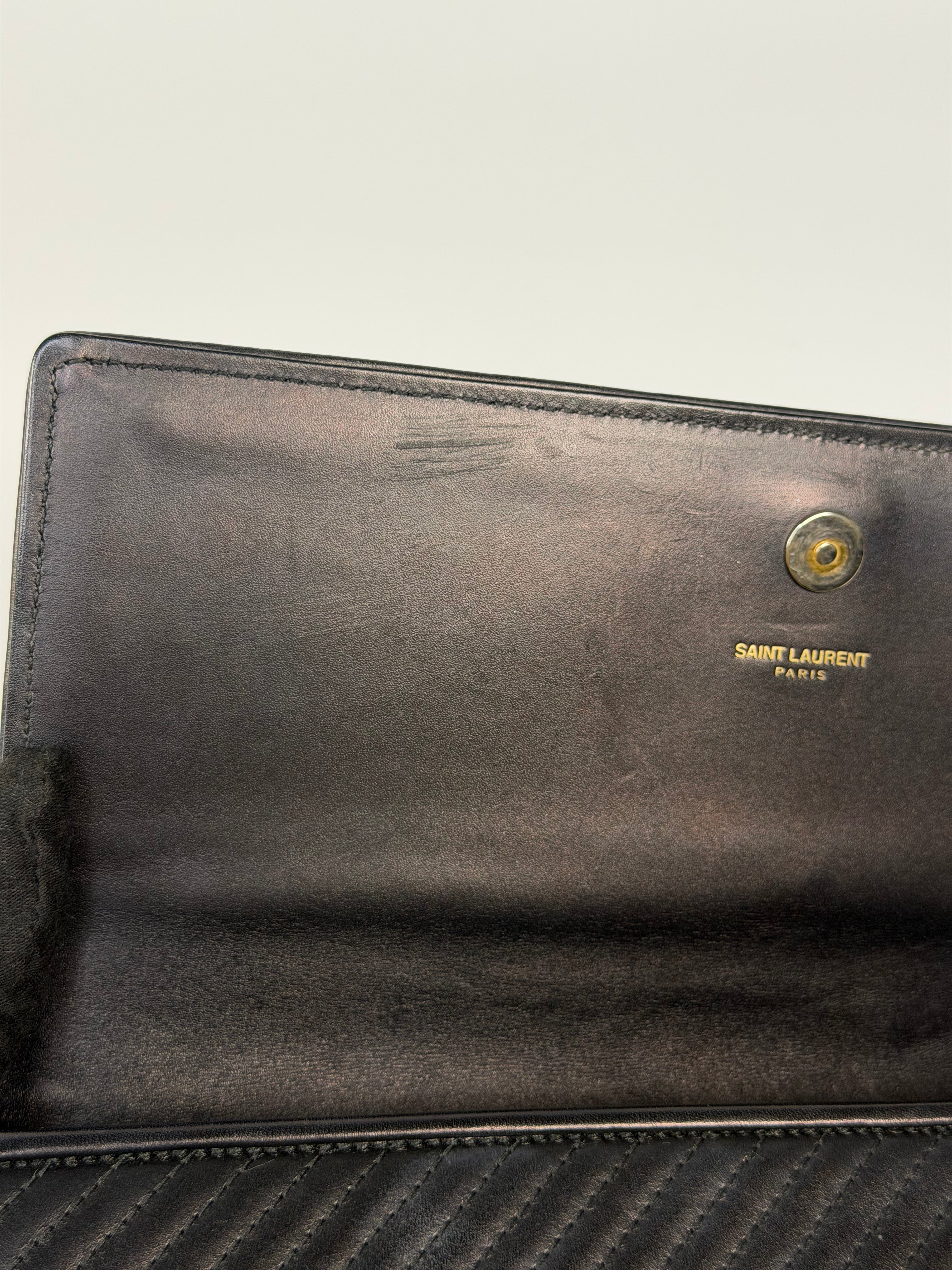 Saint Laurent Kate Long Clutch In Black Leather Gold Hardware. 100% authentic and preloved in very good condition