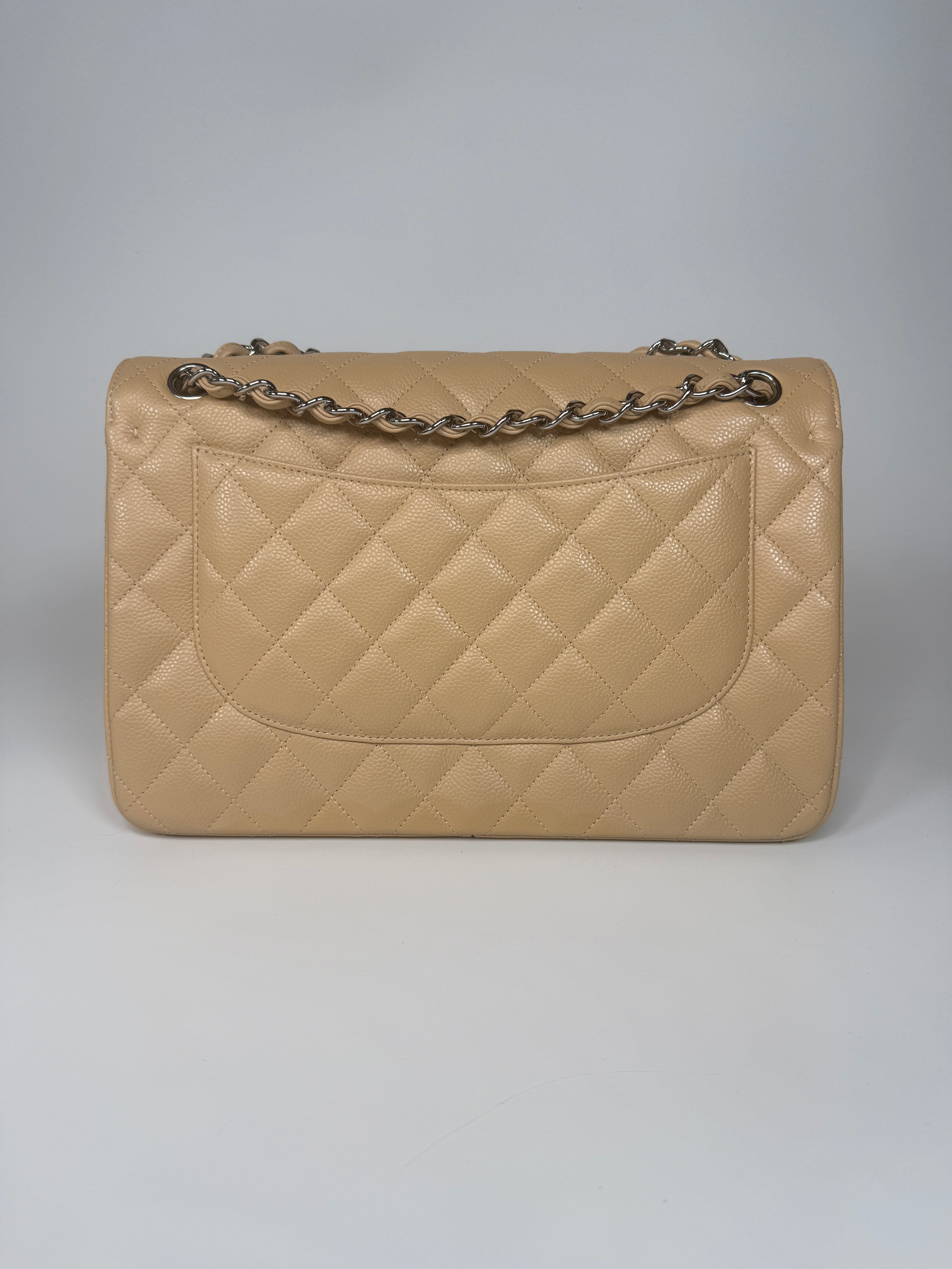 Authentic and preloved Chanel Jumbo Classic Flap Bag In Beige Caviar Leather With Silver Hardware. 100% Authenticity guarantee. Verified by Luxe Cheshire. Fully Insured next day delivery