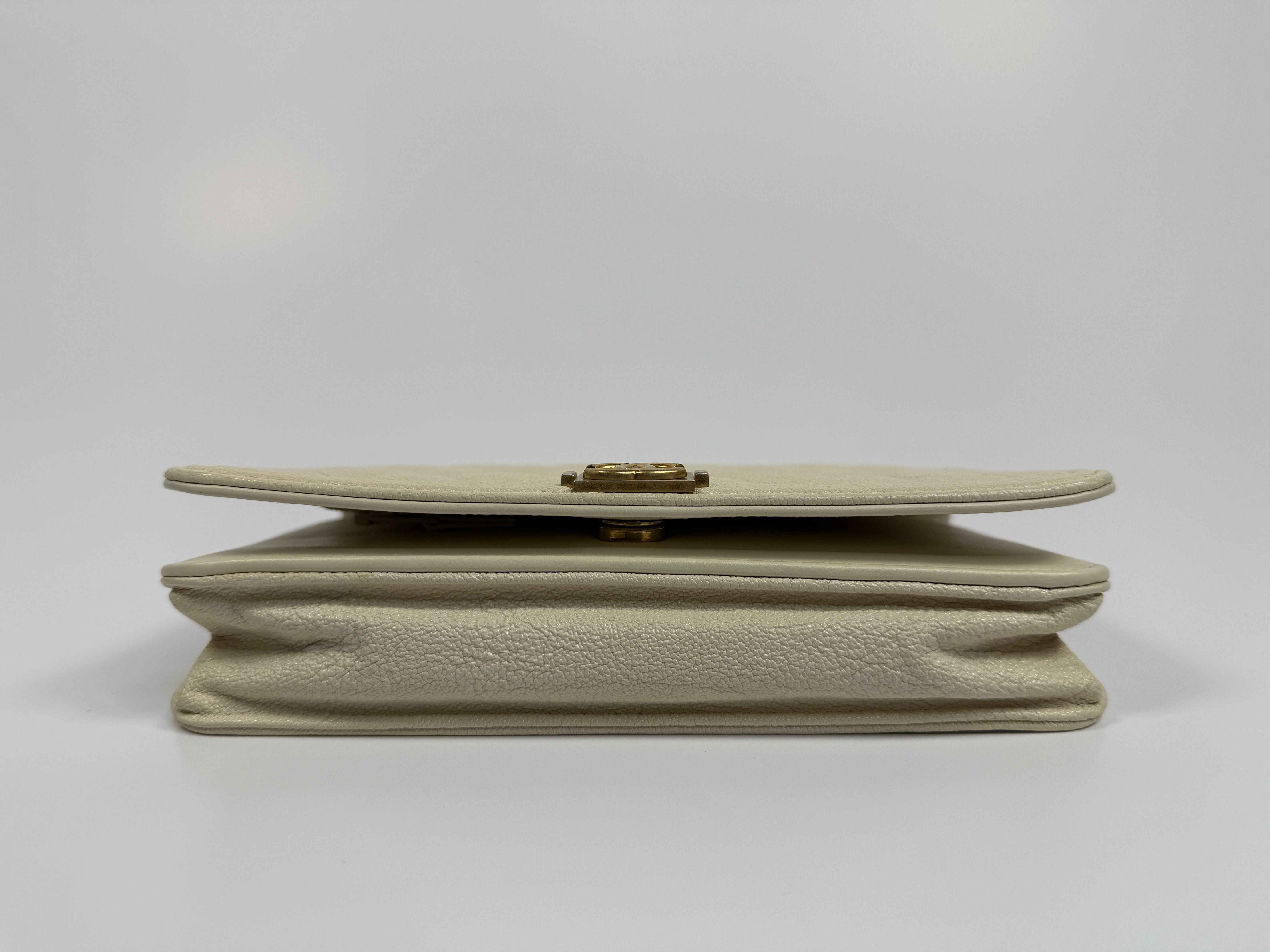 Authentic and pre loved Chanel Boy Wallet On Chain In White Caviar Leather With Gold Hardware. Excellent Condition