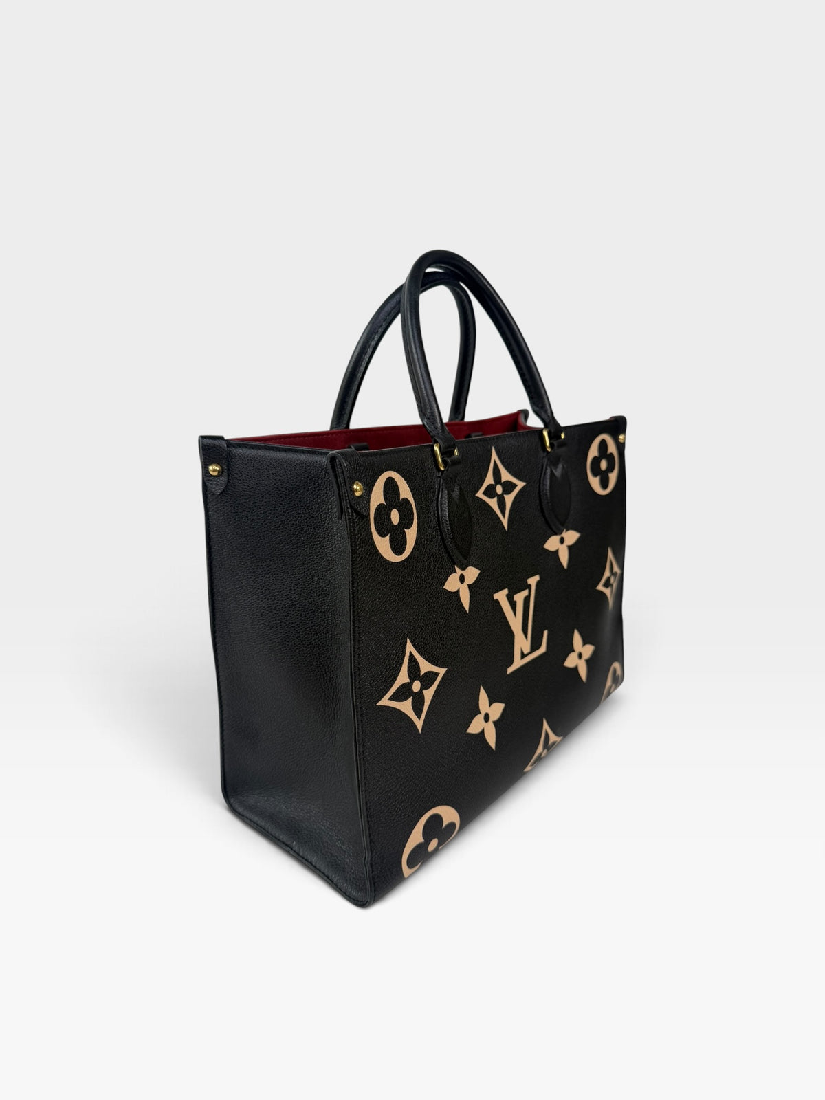 Louis Vuitton On The Go MM Tote In Black & Beige Leather With Gold Hardware. 100% authentic and preloved in excellent condition