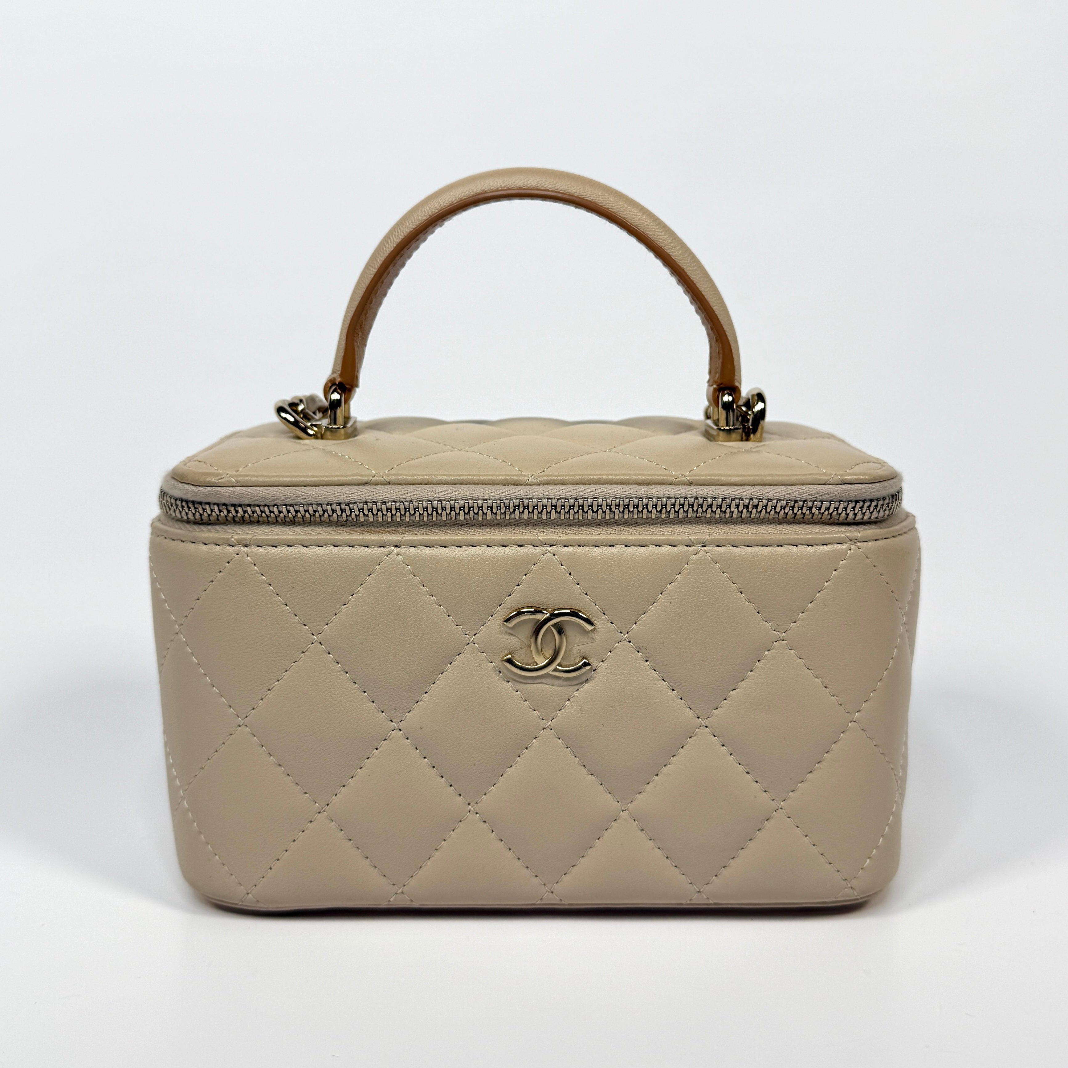 Chanel Vanity Rectangular Top Handle Ecru/Beige Lambskin With Gold Hardware Authentic and preloved. Excellent condition.