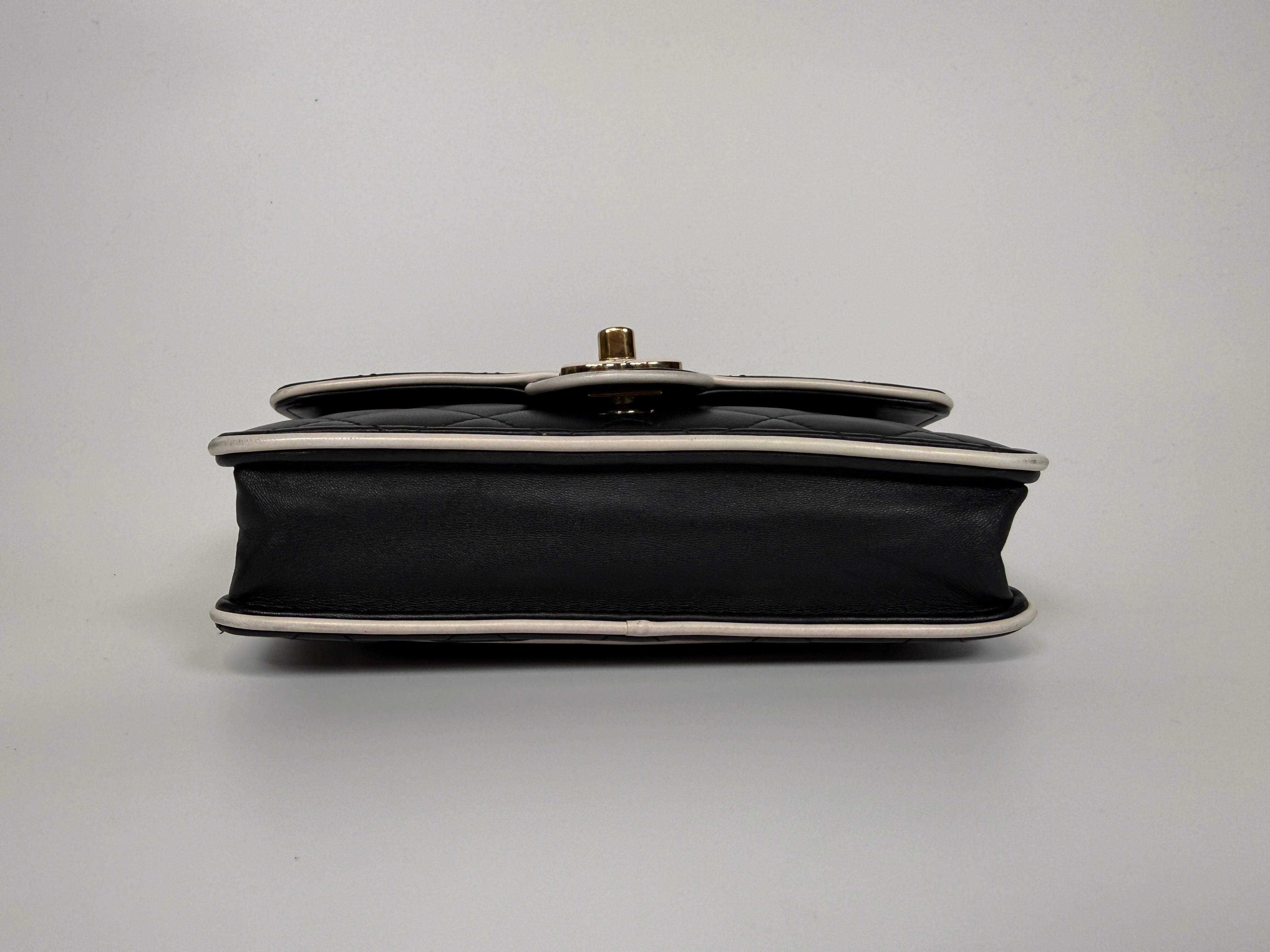 Authentic and preloved Chanel Wallet On Chain In Black & White Lambskin Leather With Pale Gold Hardware. Very Good Condition. 100% Authenticity Guarantee