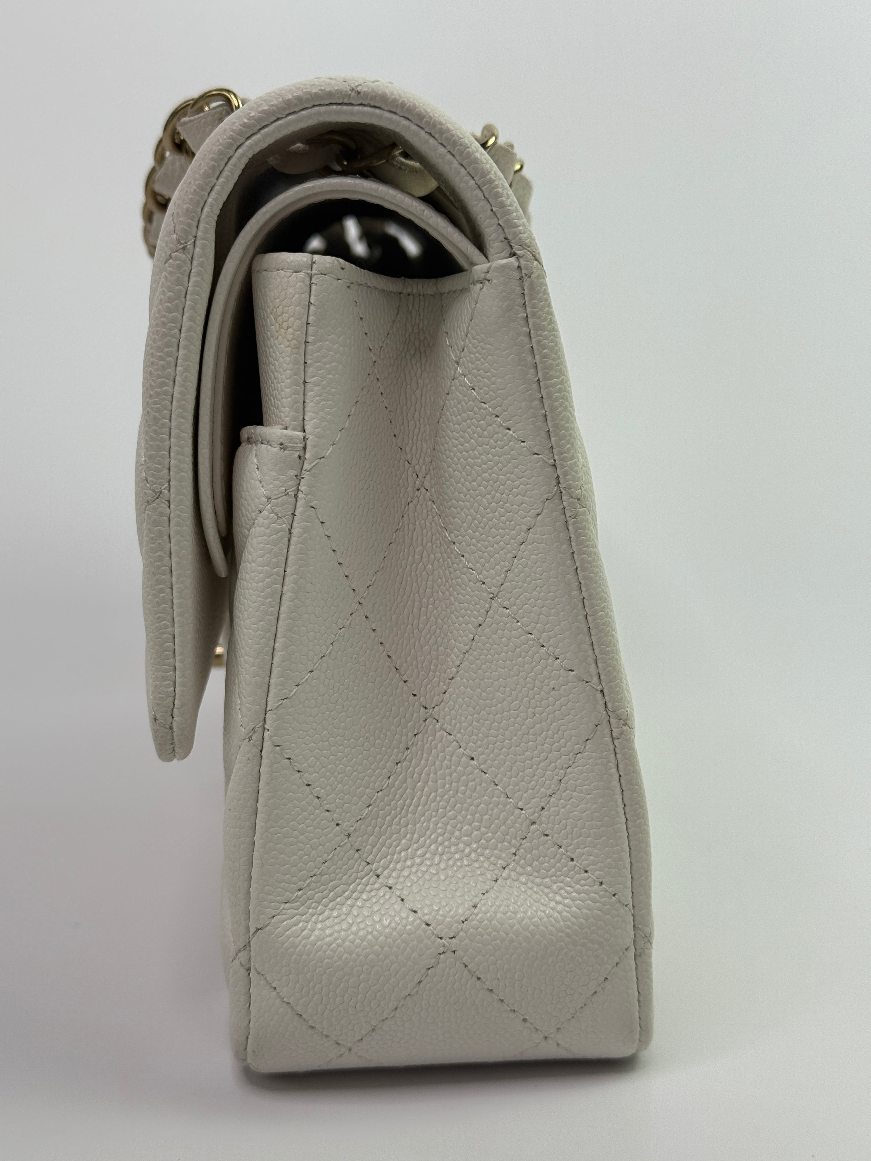 Authentic pre-loved Chanel Medium Classic Double Flap White Caviar Leather With Gold Hardware.