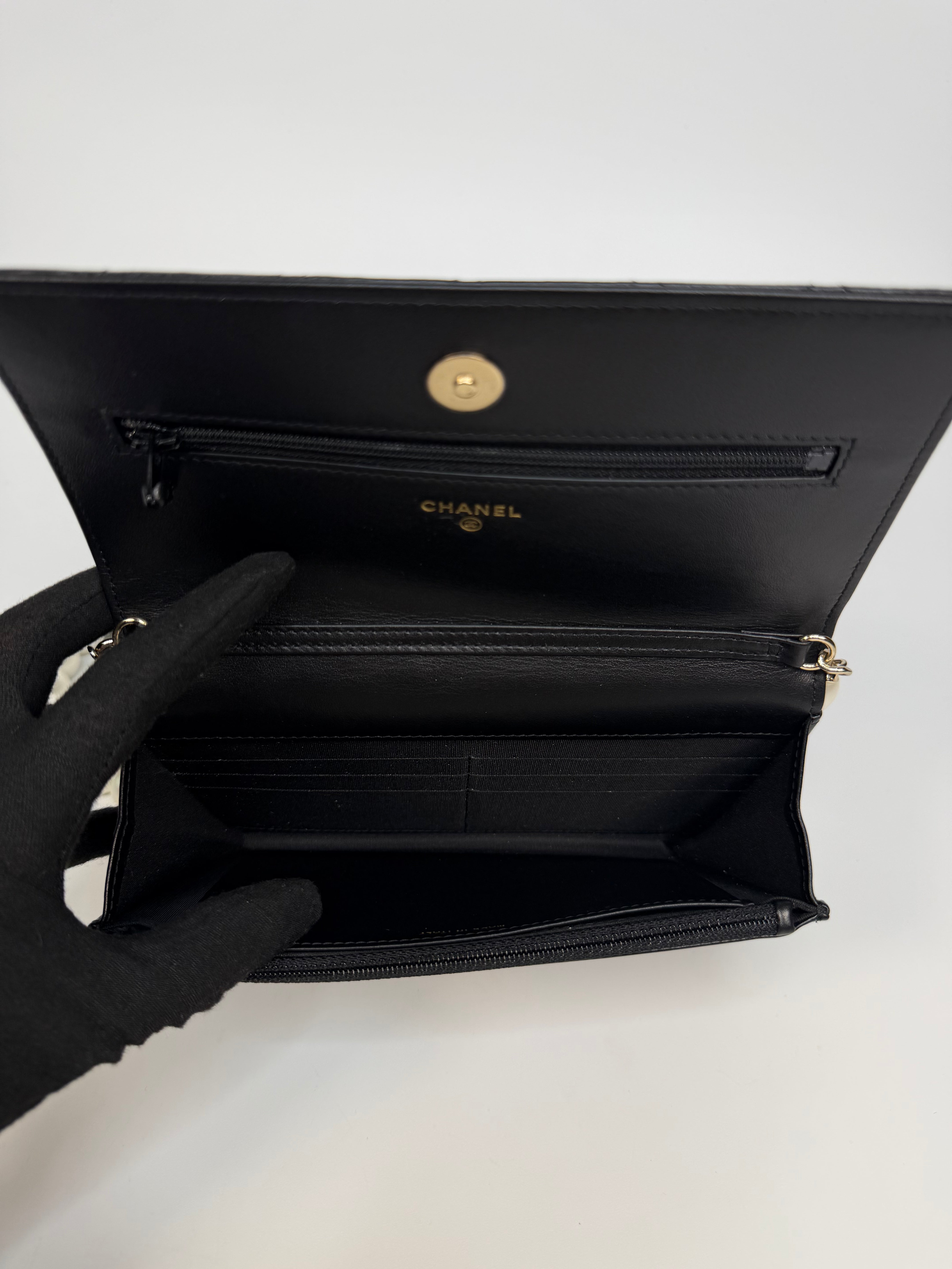 Chanel Pearl Wallet On Chain In Black Lambskin Leather With Gold Hardware. Authentic and preloved in very good condition.