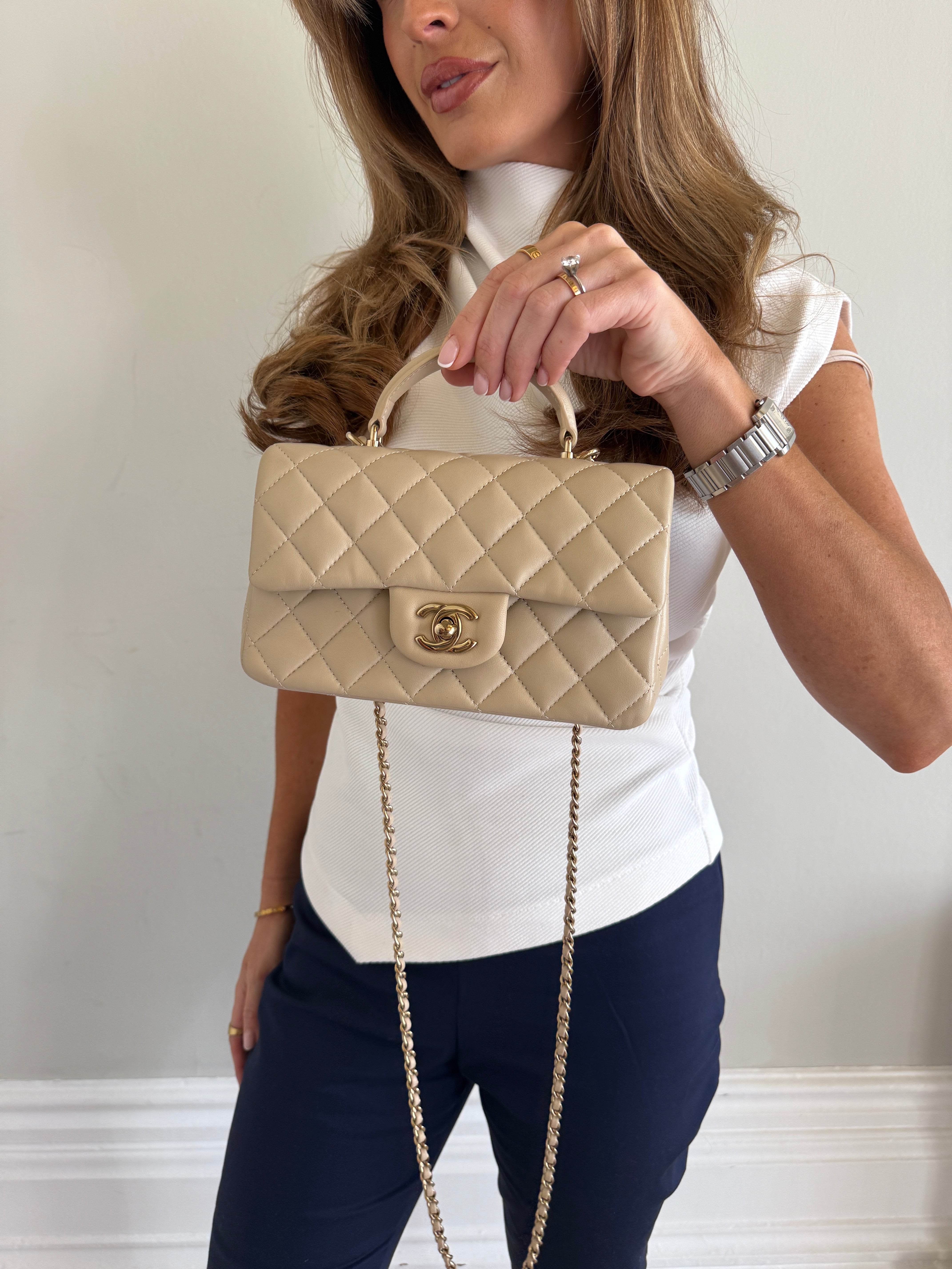 Authentic and preloved Chanel Mini Rectangle Top Handle In Ecru Lambskin With Gold Hardware in excellent condition, Fully insured next day delivery. Verified by Luxe Cheshire. 100% Authenticity guarantee,