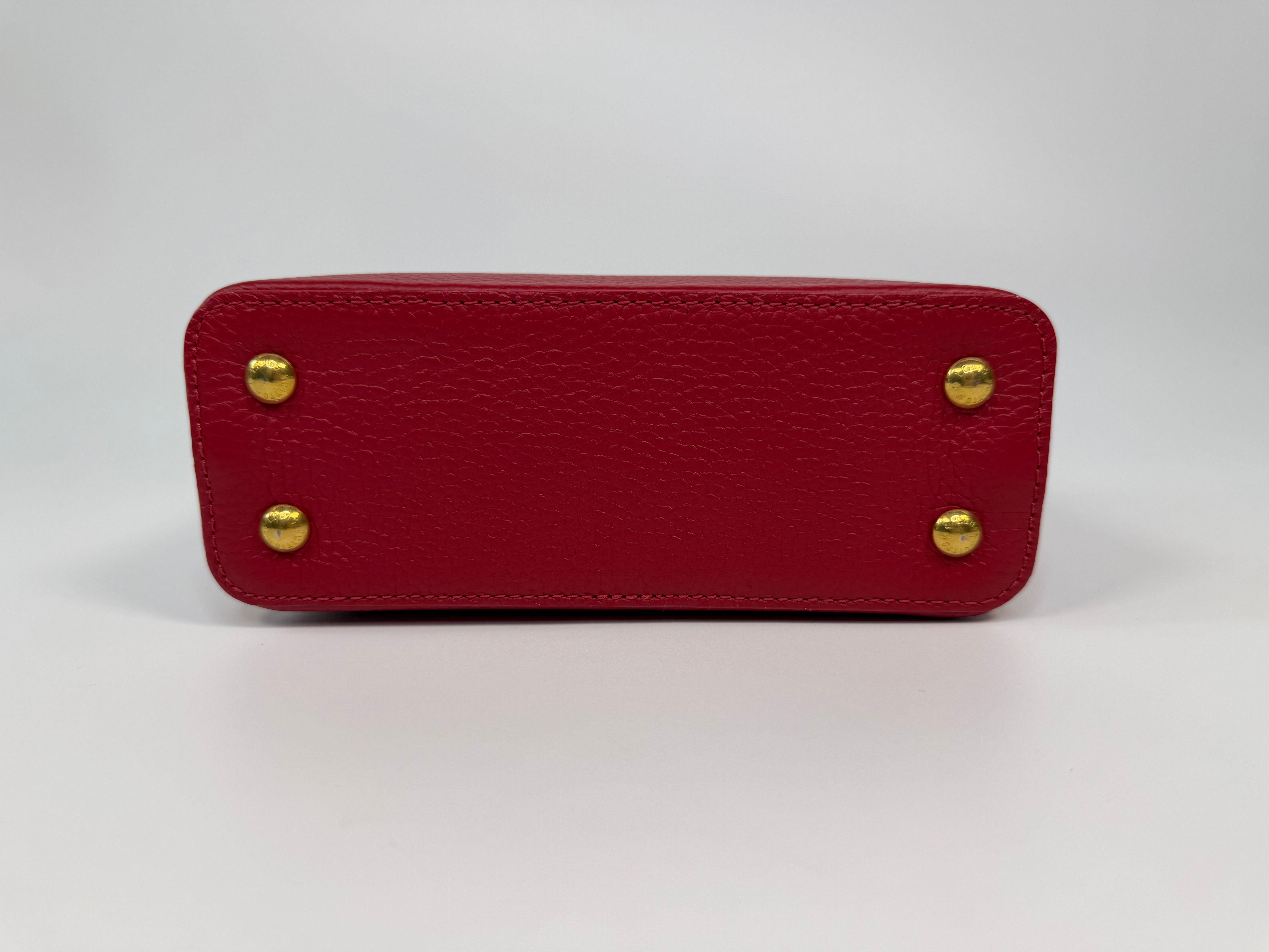 Louis Vuitton Capucines BB Bag In Scarlet Taurillion Leather With Gold Hardware. Authentic and preloved in excellent condition