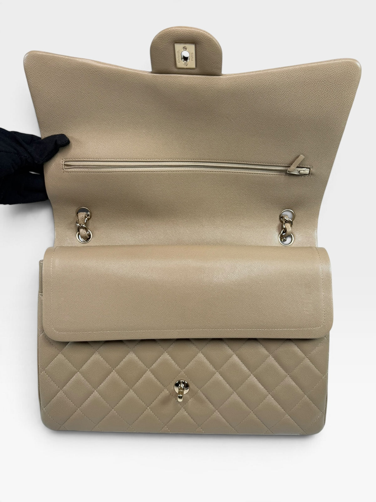 Chanel Maxi Flap In Beige Caviar Leather With Gold Hardware. 100% authentic and pre loved in excellent condition.
