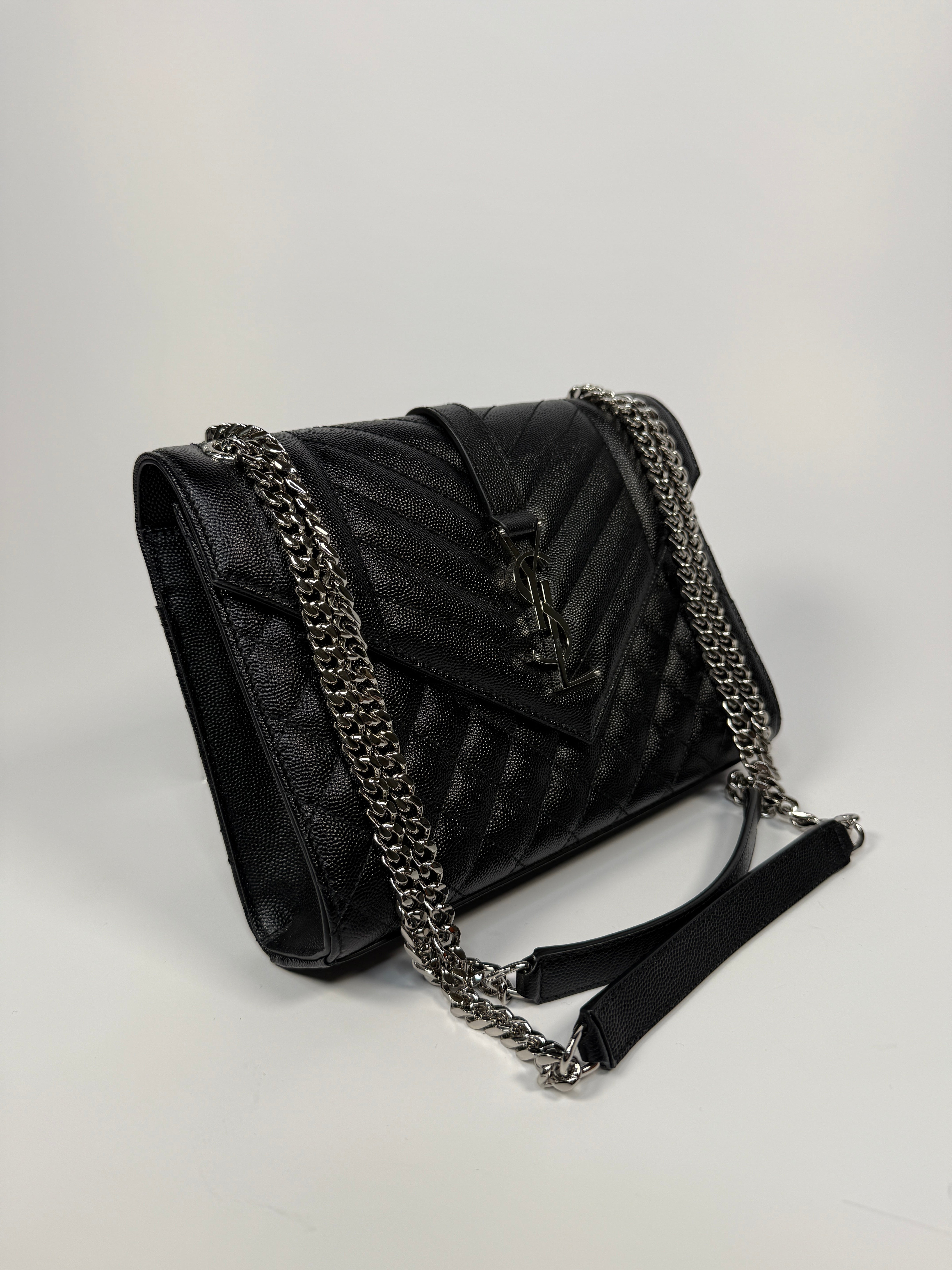 Saint Laurent Medium Envelope Bag In Blacked Grained Leather With Silver Hardware. Authentic and preloved. Excellent Condition