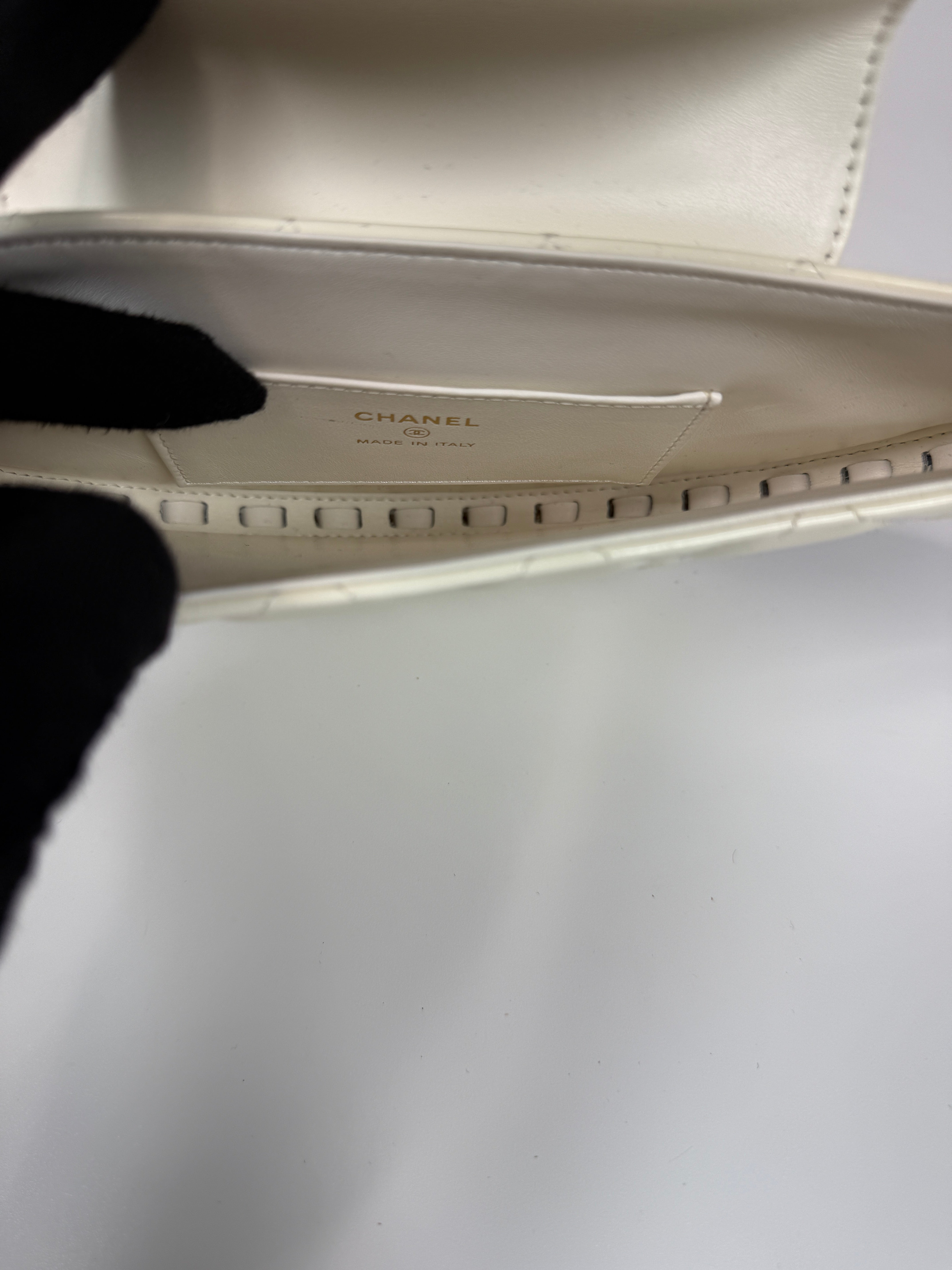 Authentic and preloved Chanel White Quilted Patent Leather Chain Around Hoop Bag In Excellent condition. 100% Authenticity Guarantee