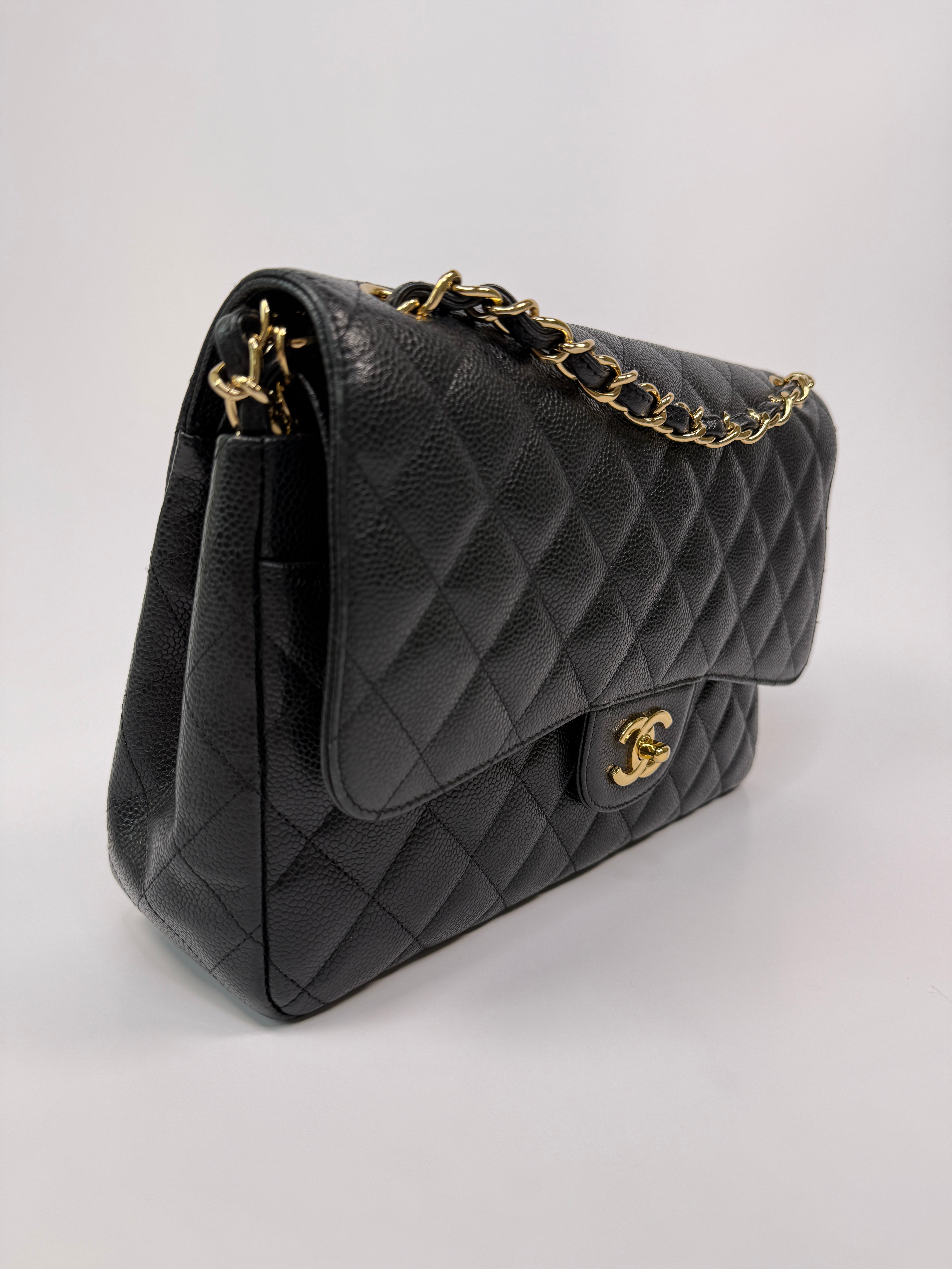 Chanel Classic Jumbo Flap Bag In Black Caviar LeatherWith Gold Hardware
Pre Loved & Authentic