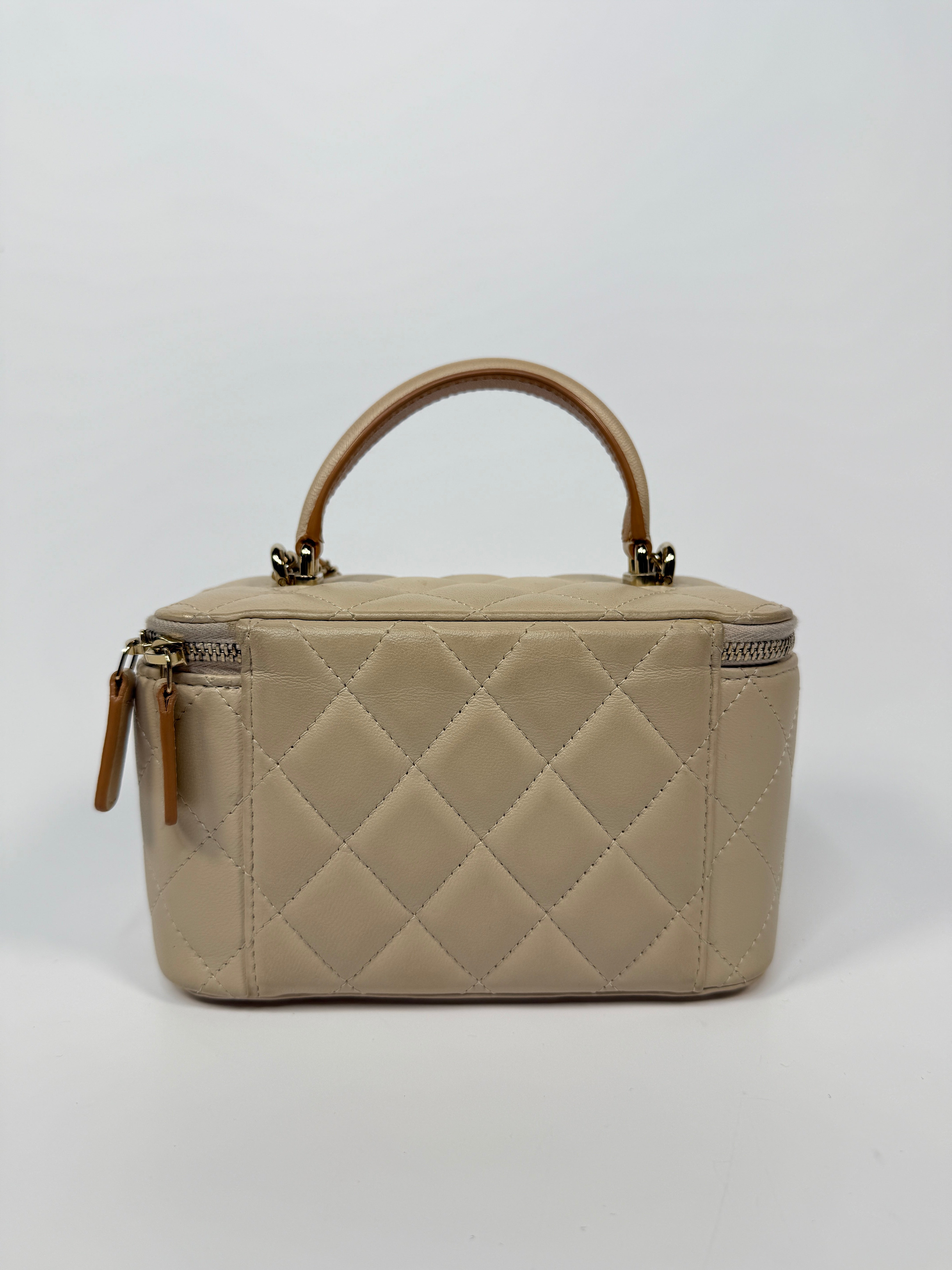 Chanel Vanity Rectangular Top Handle Ecru/Beige Lambskin With Gold Hardware Authentic and preloved. Excellent condition.