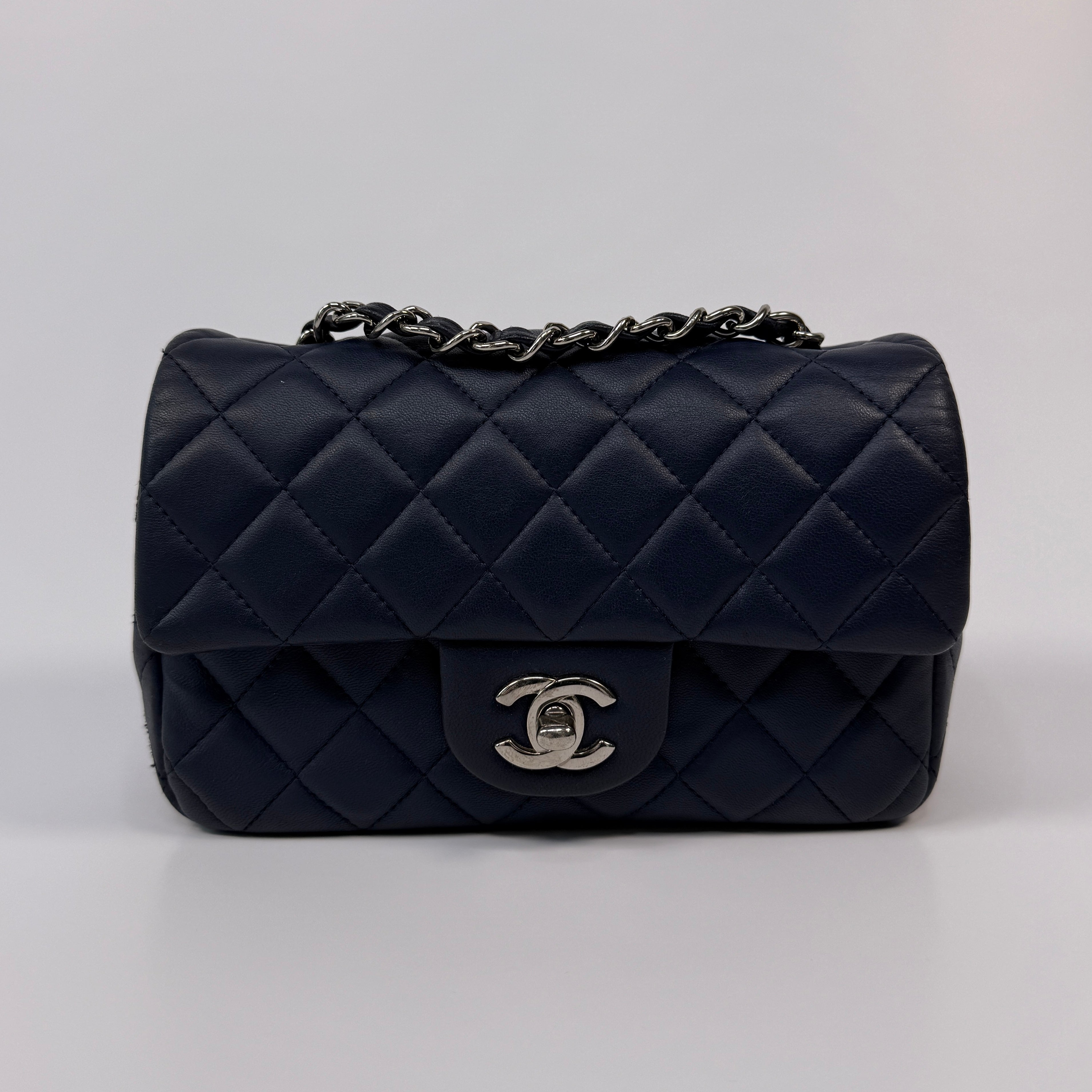Chanel Mini Rectangle Flap Bag In Navy Lambskin With Silver Hardware
Pre Loved & Authentic