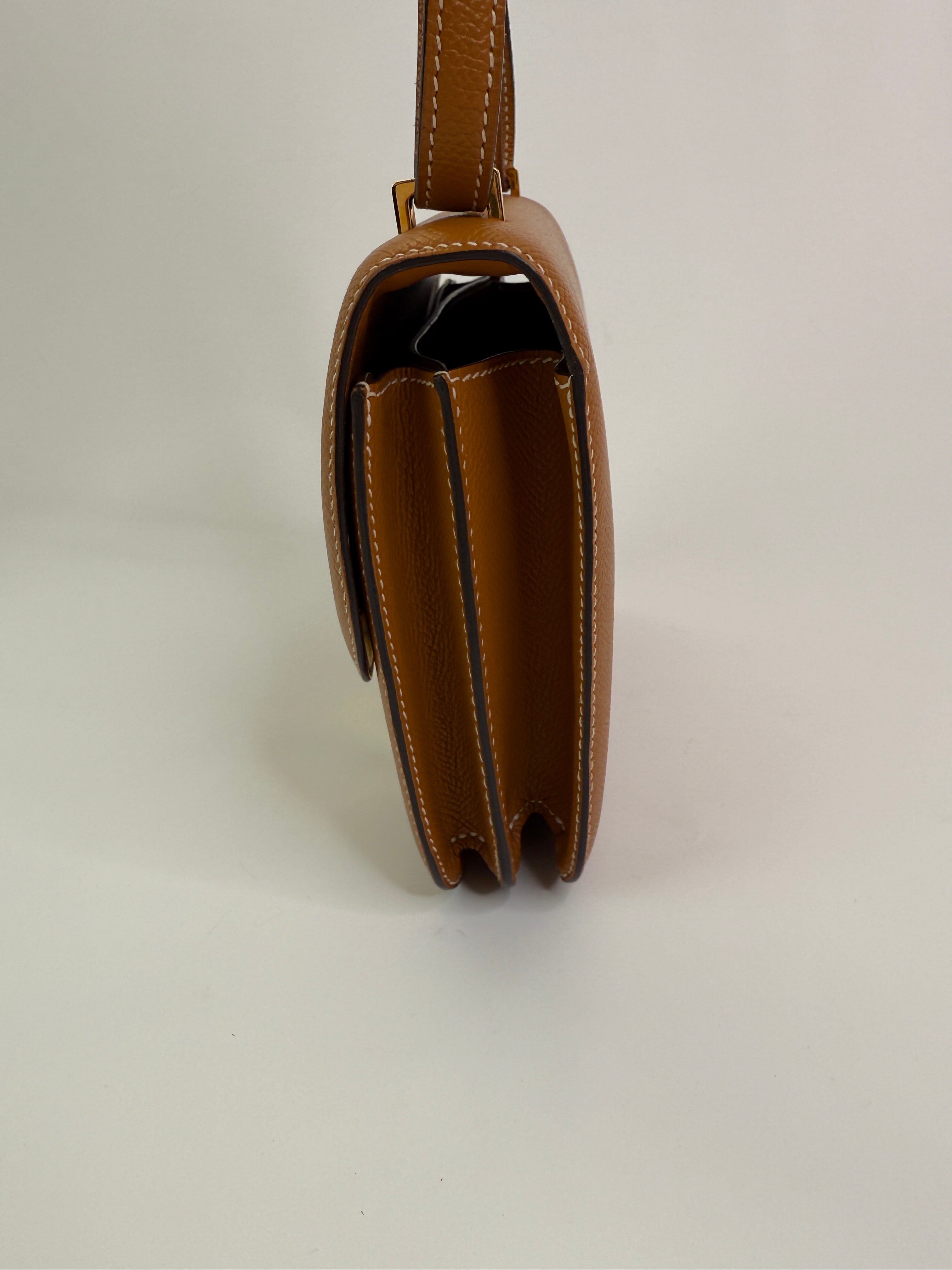 Authentic pre-lovedHermès Constance 18 In Toffee Epsom Leather With Gold Hardware.