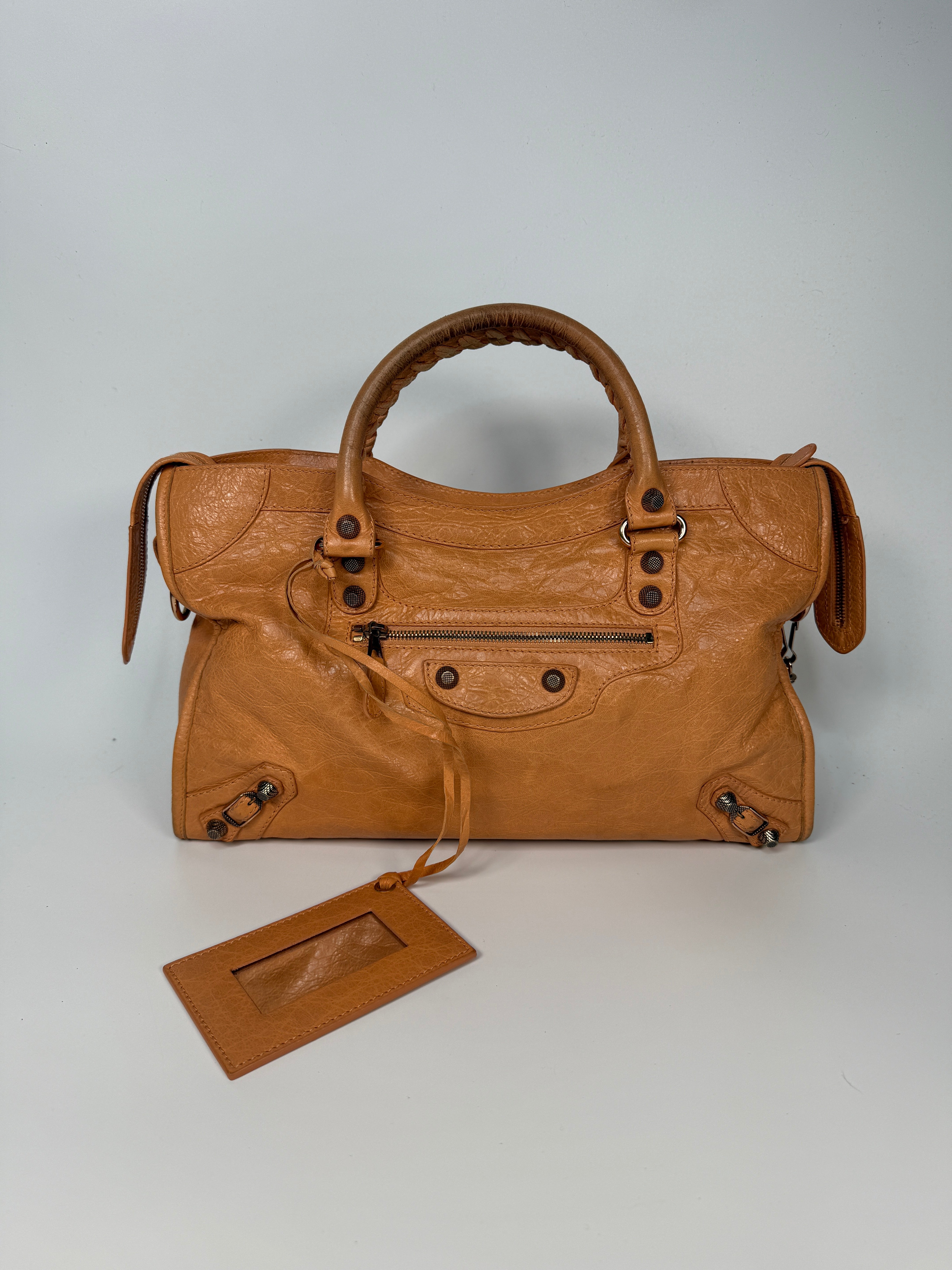 Authentic and preloved Balenciaga Medium Le City Bag In Peach Leather with silver hardware. Very good condition. 100% Authenticity guarantee.