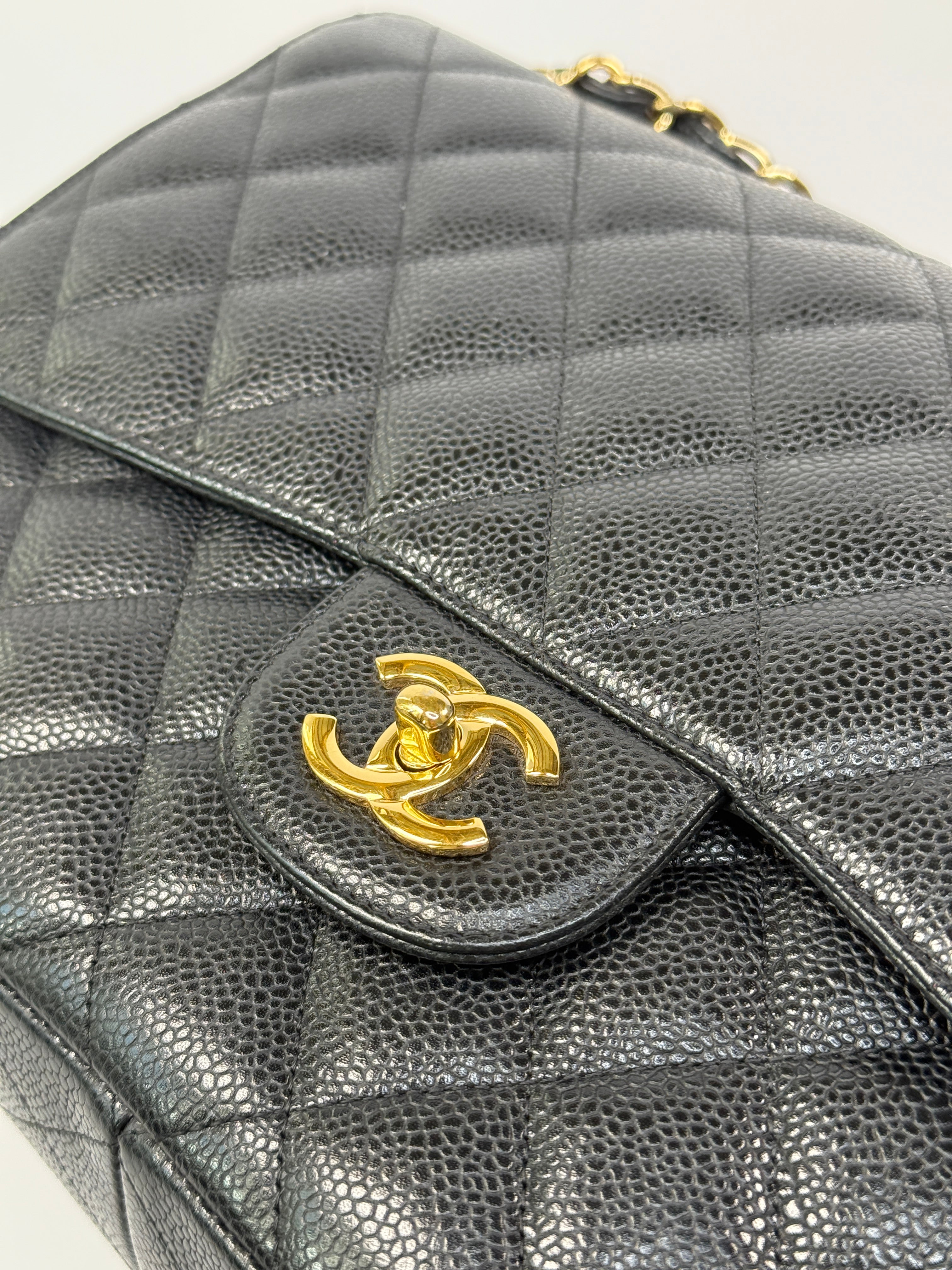 Chanel Classic Jumbo Flap Bag In Black Caviar LeatherWith Gold Hardware
Pre Loved & Authentic