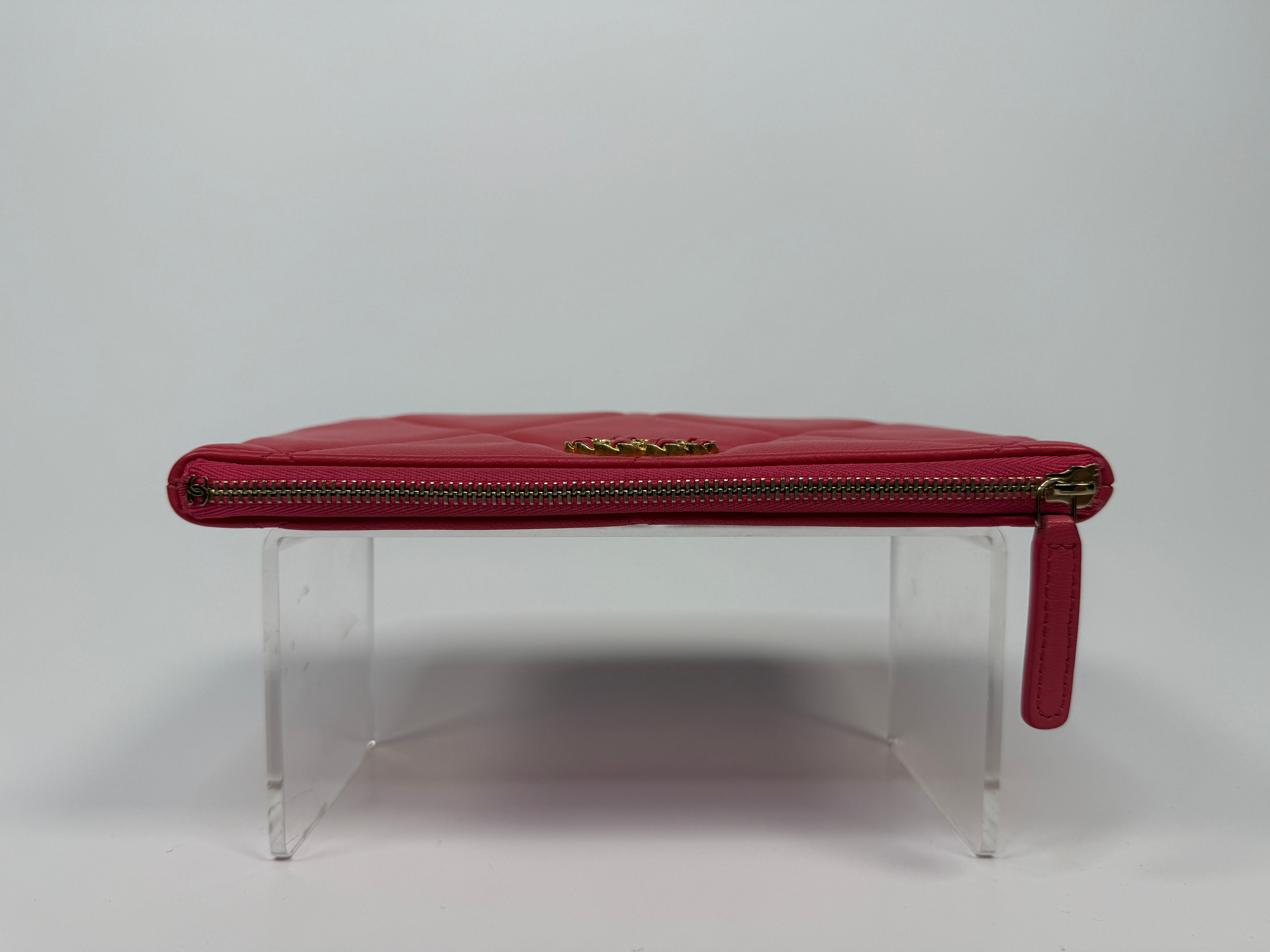 Chanel 19 Zip Pouch In Pink Calfskin Leather With Gold Hardware. Authentic preloved condition.