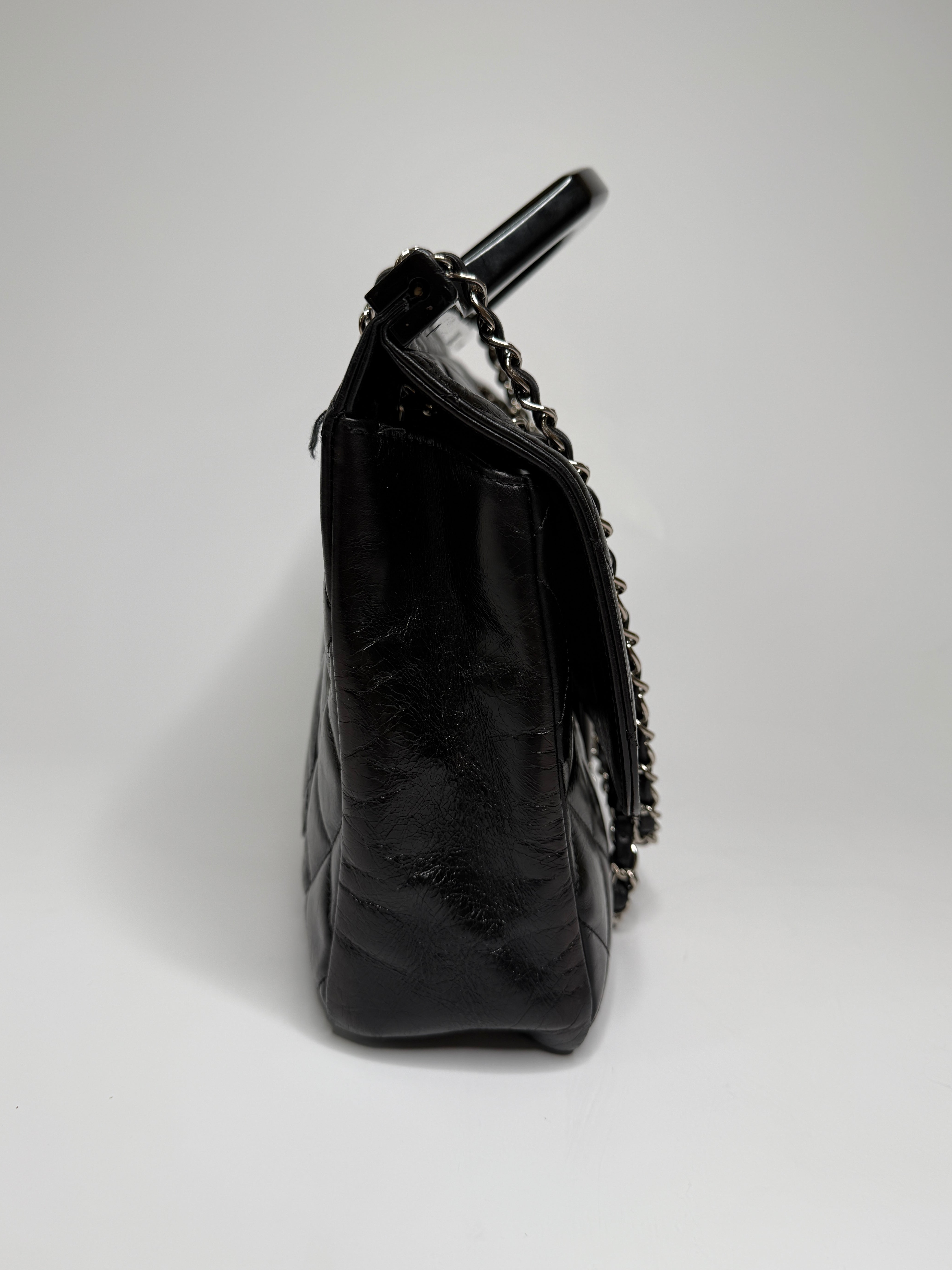 Chanel Delivery Top Handle Flap Bag In Black Calfskin Leather With Silver hardware in very good condition Authentic and preloved