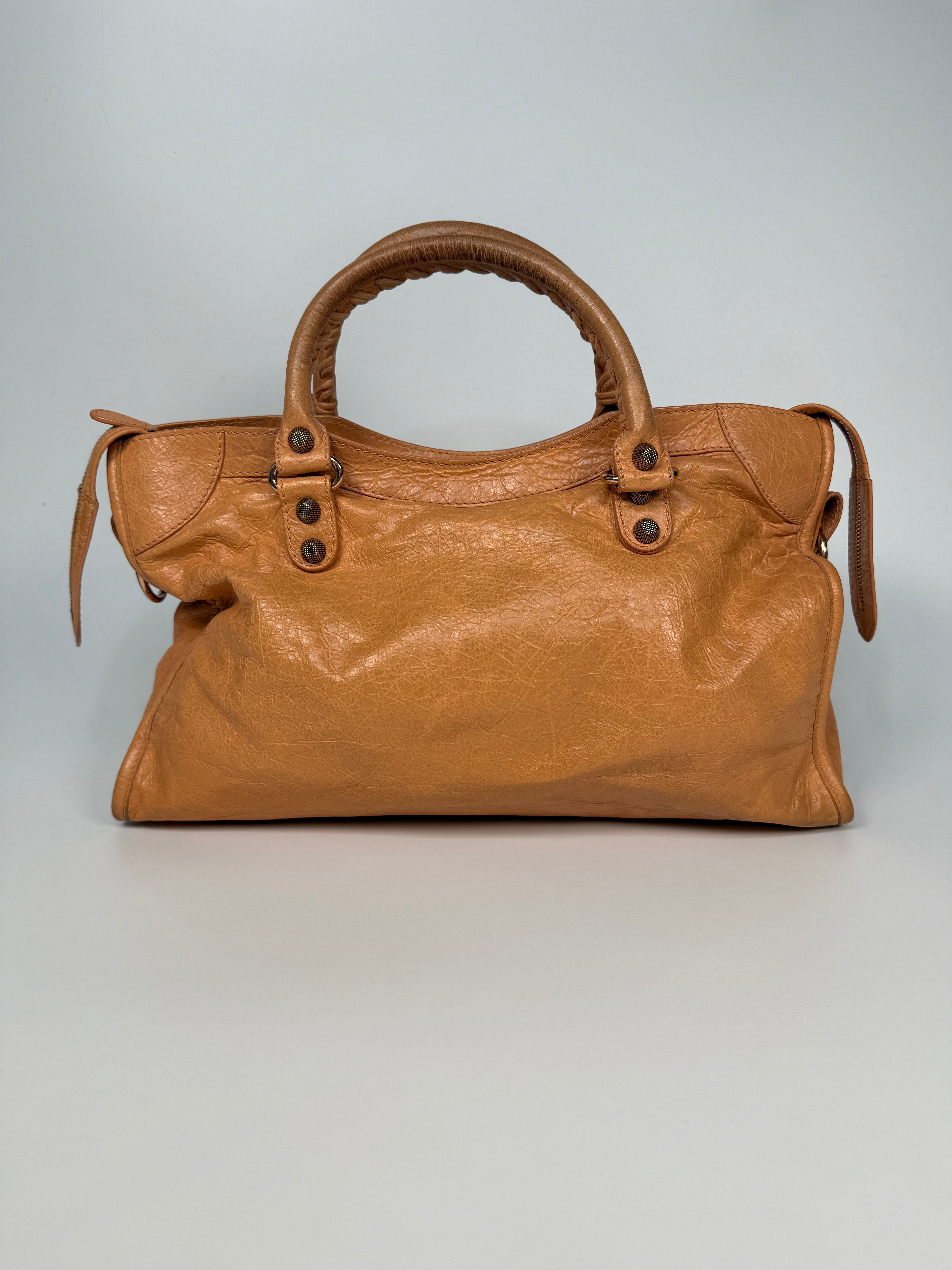 Authentic and preloved Balenciaga Medium Le City Bag In Peach Leather with silver hardware. Very good condition. 100% Authenticity guarantee.