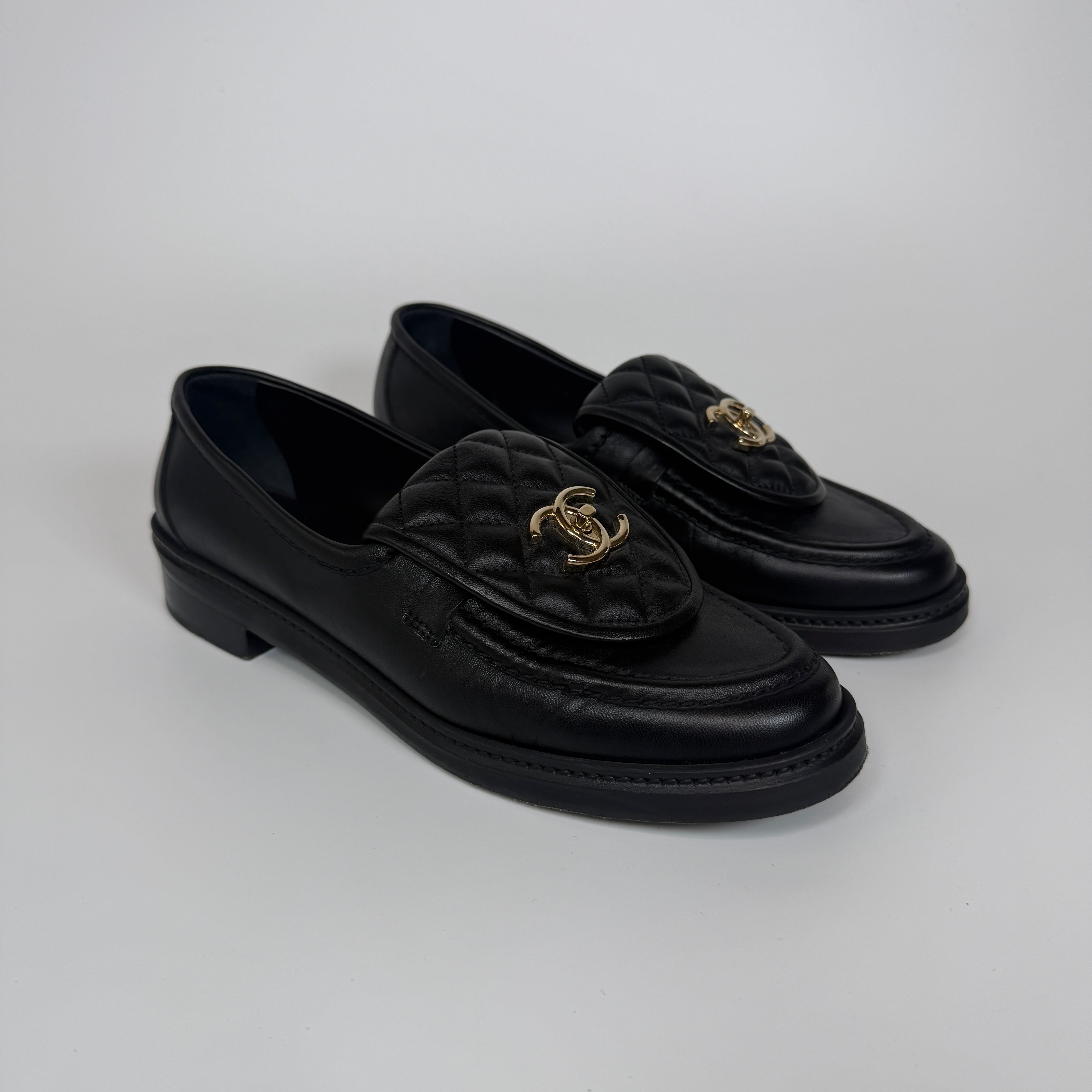 Authentic and preloved Chanel Black Quilted Leather Turnlock Loafers (Size 39/UK6) Excellent condition. 100% Authenticity guarantee