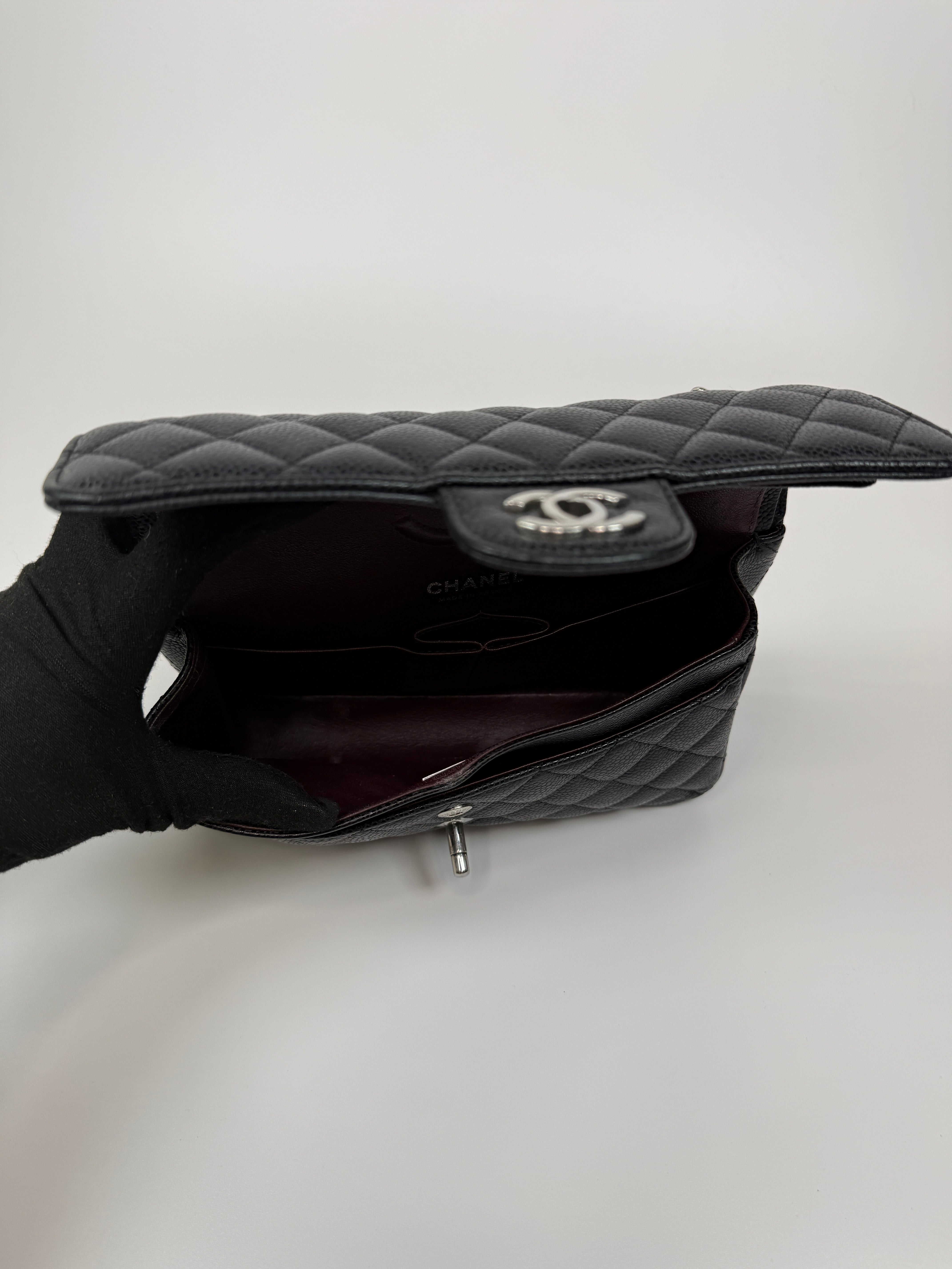 Chanel Small Classic Double Flap In Black Caviar Leather With Silver Hardware. Authentic and preloved in very good condition. 100% Authenticity guarantee