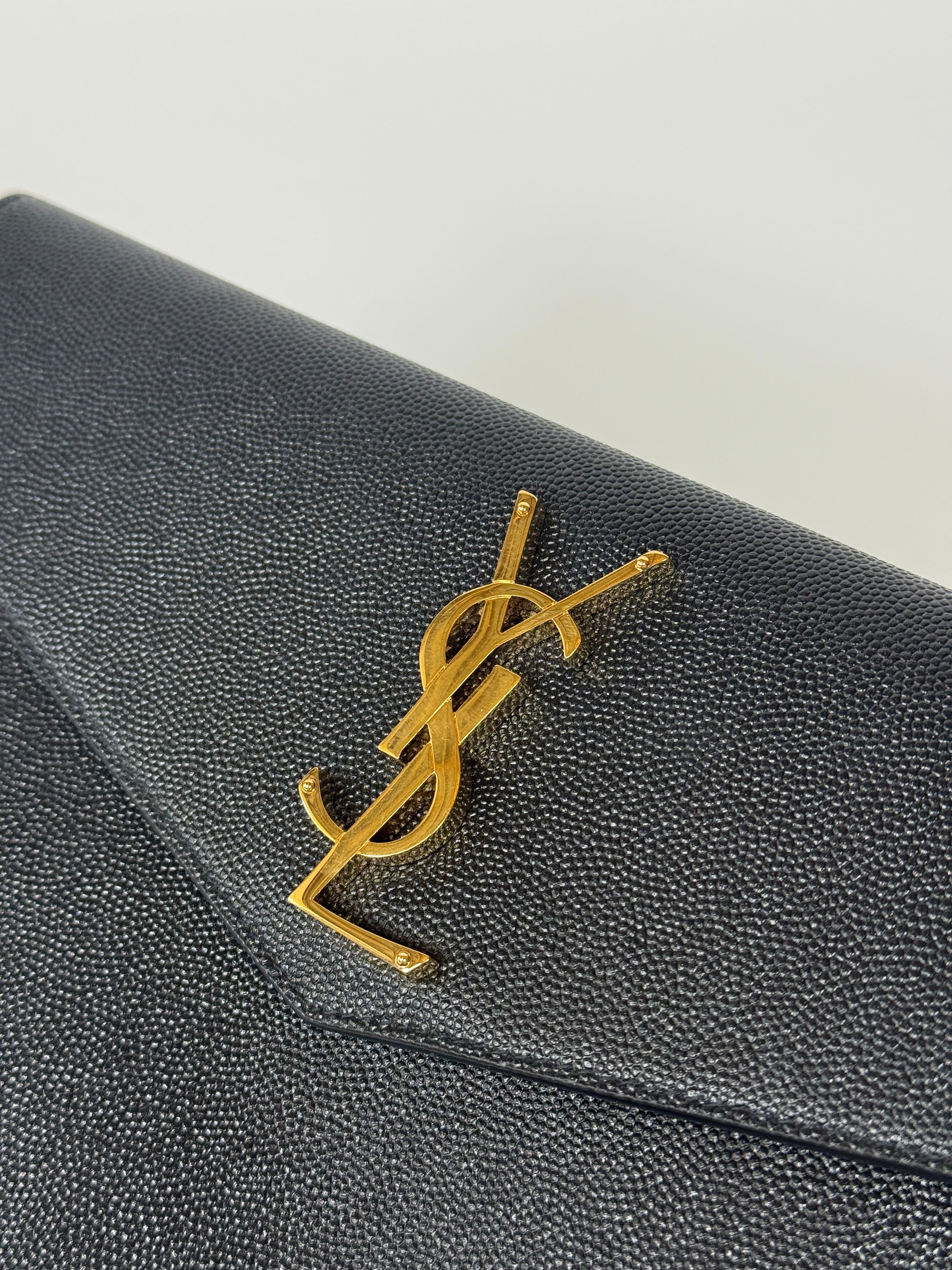 Saint Laurent Uptown Clutch In Black Leather With Gold Hardware. Authentic and preloved, 100% authenticity guarantee
