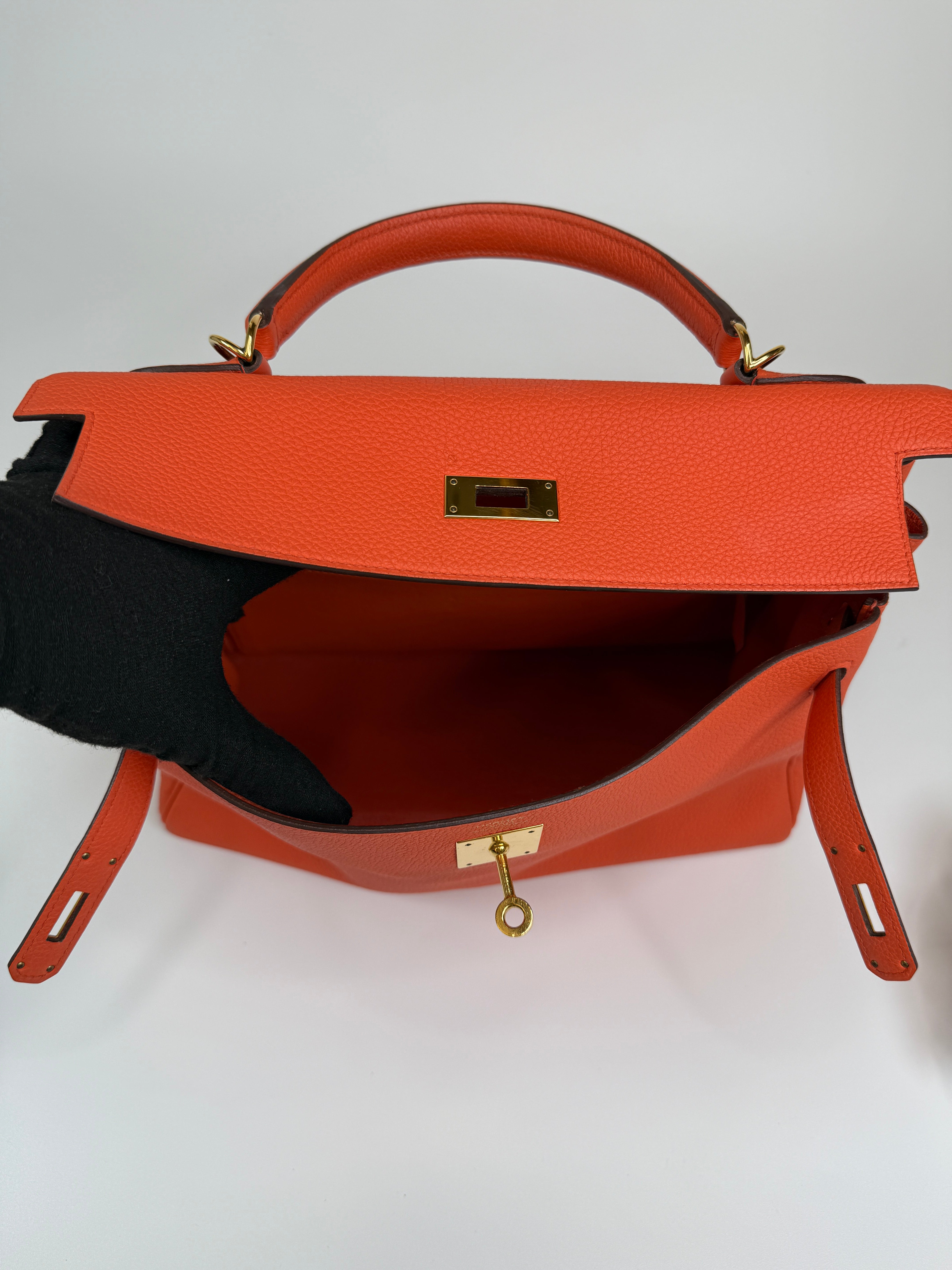 Authentic and preloved Hermès Kelly 28 In Cappucine Togo Leather Gold Hardware. Very Good Condition. 100% Authenticity guarantee