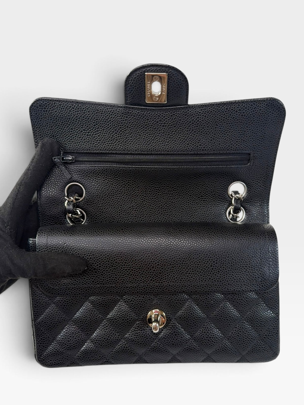 Chanel Vintage Small Classic Double Flap In Black Caviar Leather With Silver Hardware. 100% authentic and preloved in excellent condition