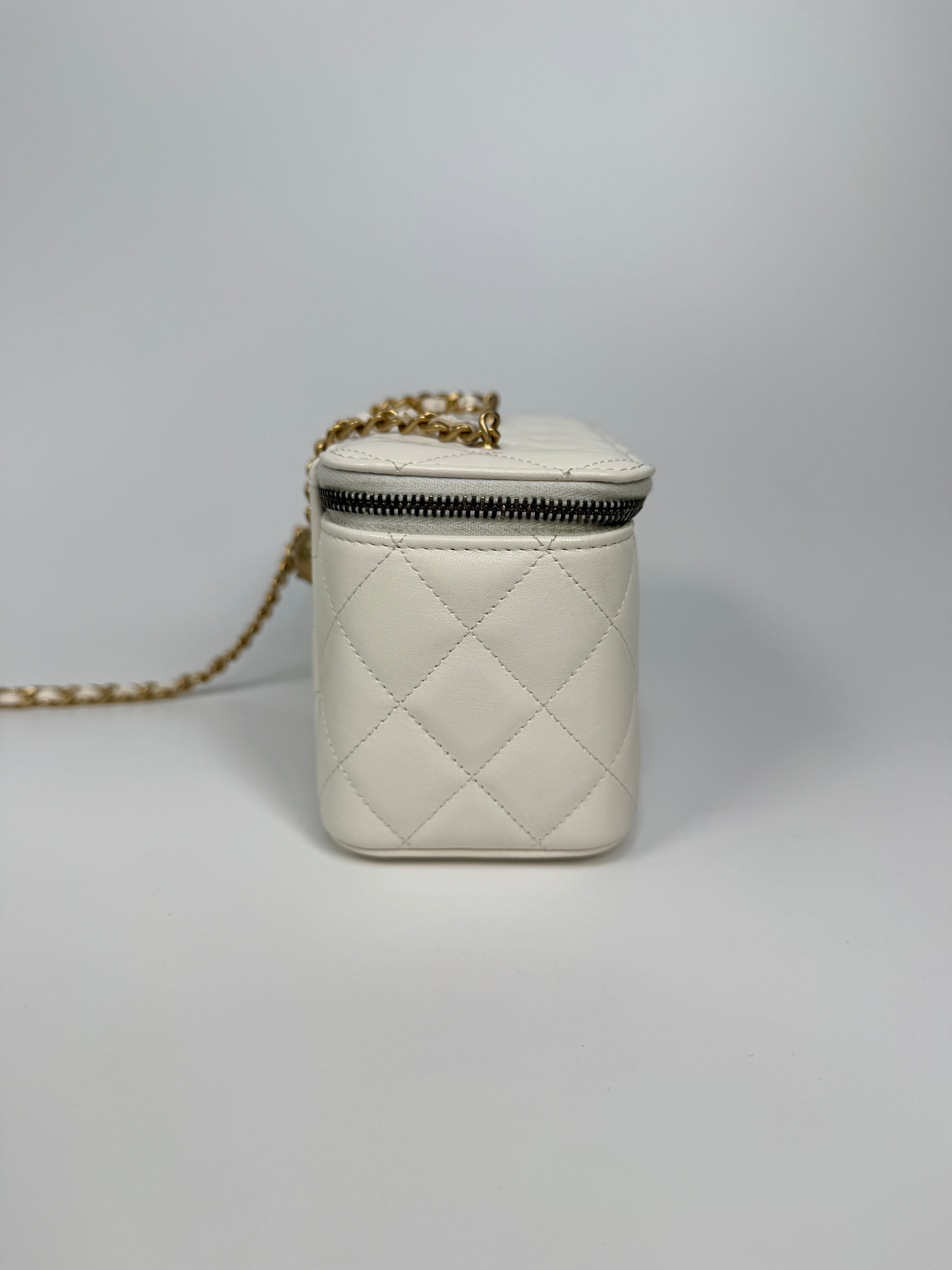 Authentic and preloved Chanel Quilted Pearl Crush Mini Vanity In White Lambskin Leather With Aged Gold Hardware