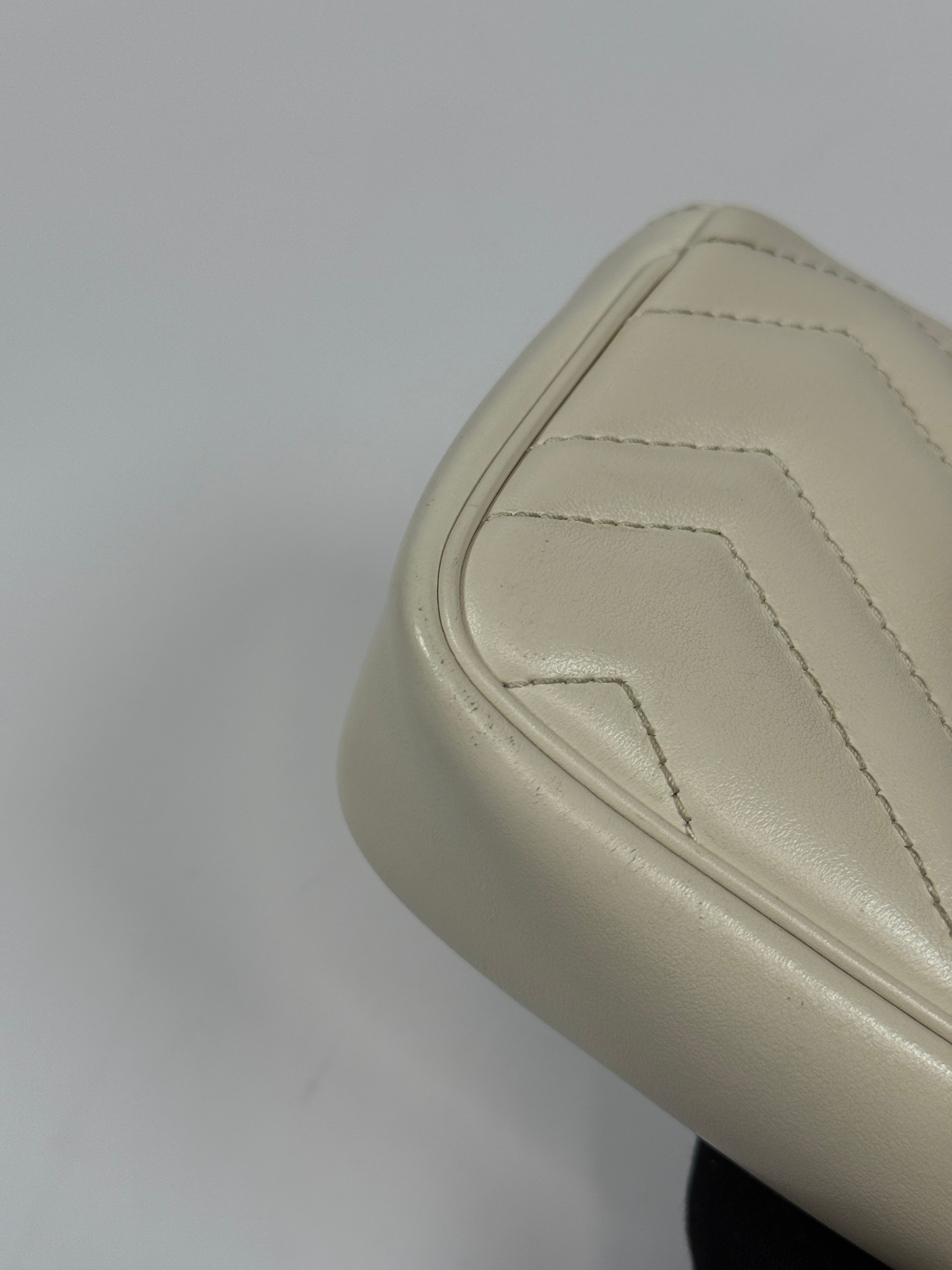 Gucci Marmont White Matelassé Super Mini Bag With Gold Hardware In Excellent pre loved condition. Authentic and preloved