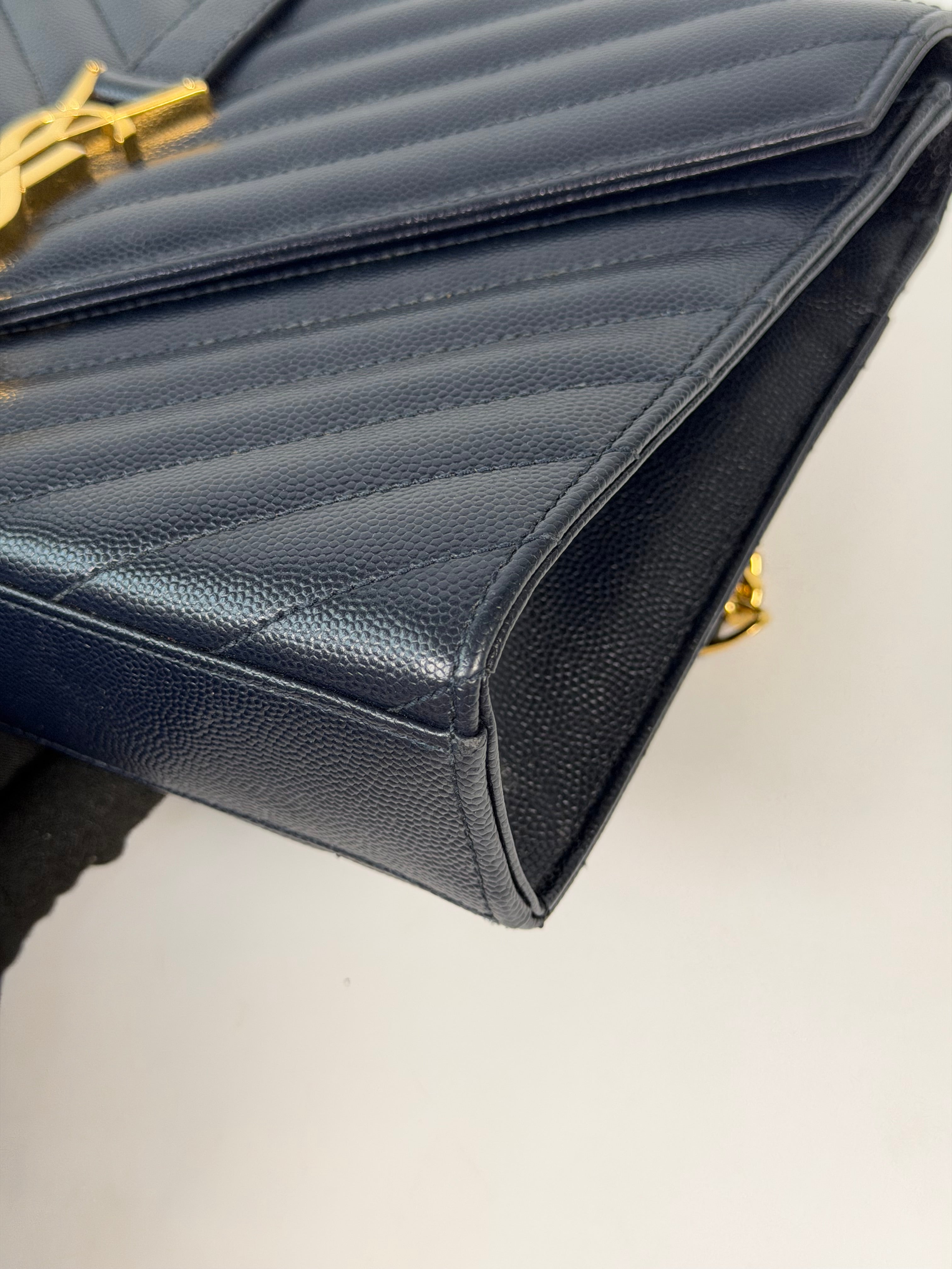 Authentic and pre loved Saint Laurent Medium Envelope Bag In Blue Grained Leather With Gold Hardware. Excellent Condition. Verified by Luxe Cheshire
