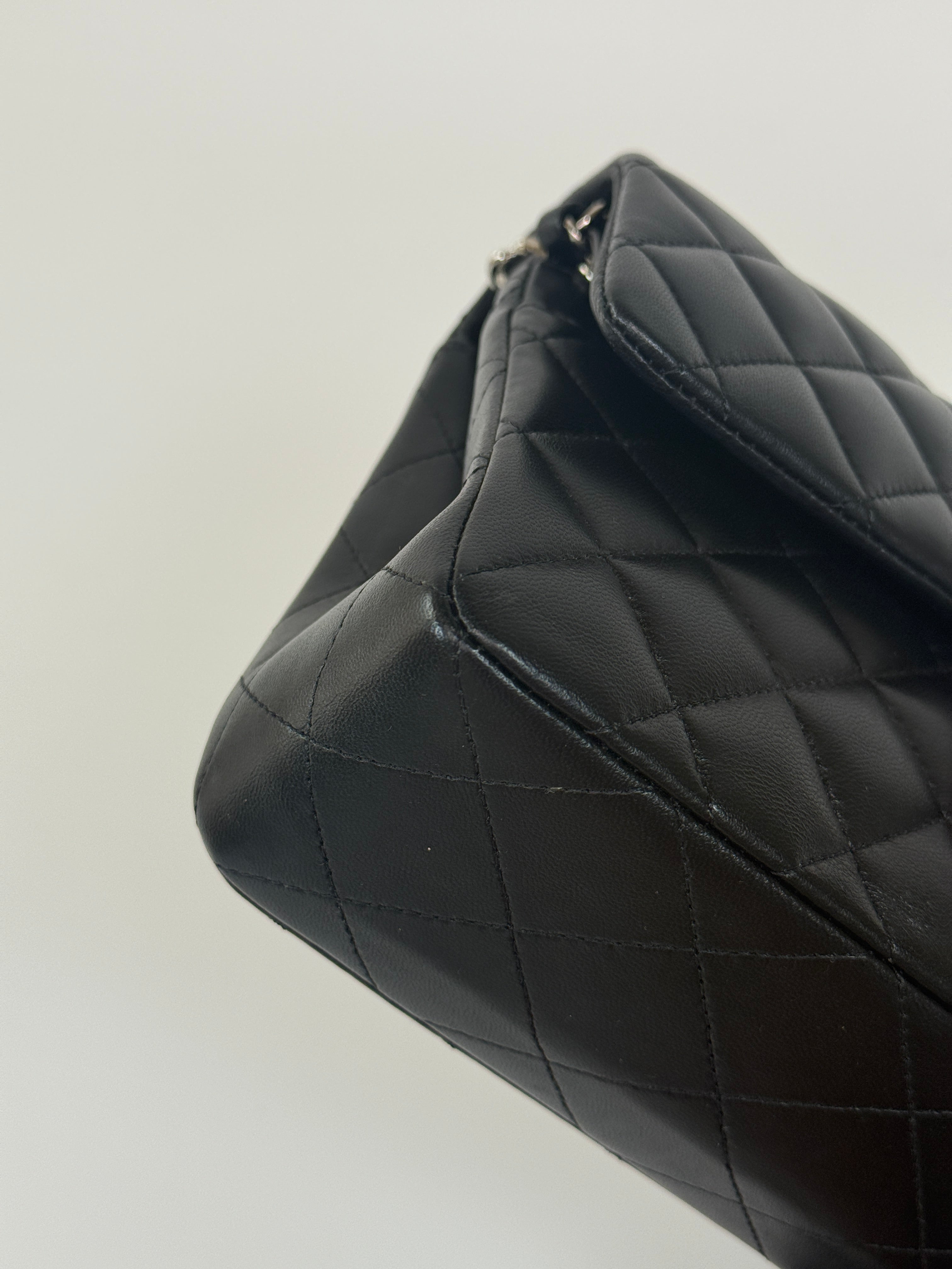 Chanel Small Classic Double Flap In Black Lambskin Leather With Silver Hardware Authentic and preloved in excellent condition. 100% Authenticity guarantee