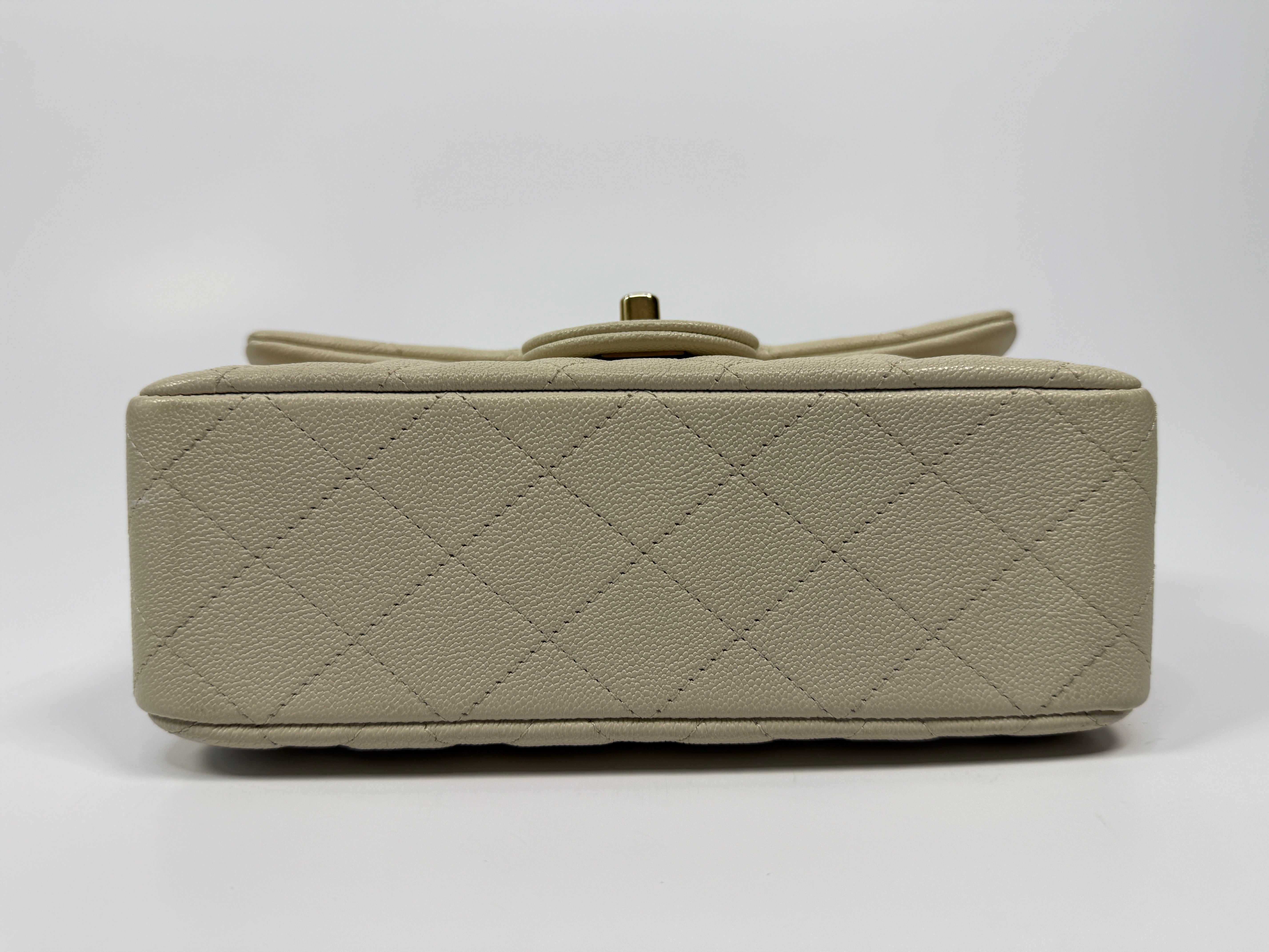 Chanel Mini Rectangle Top Handle In Ecru Caviar With Gold hardware, authentic and preloved in excellent condition