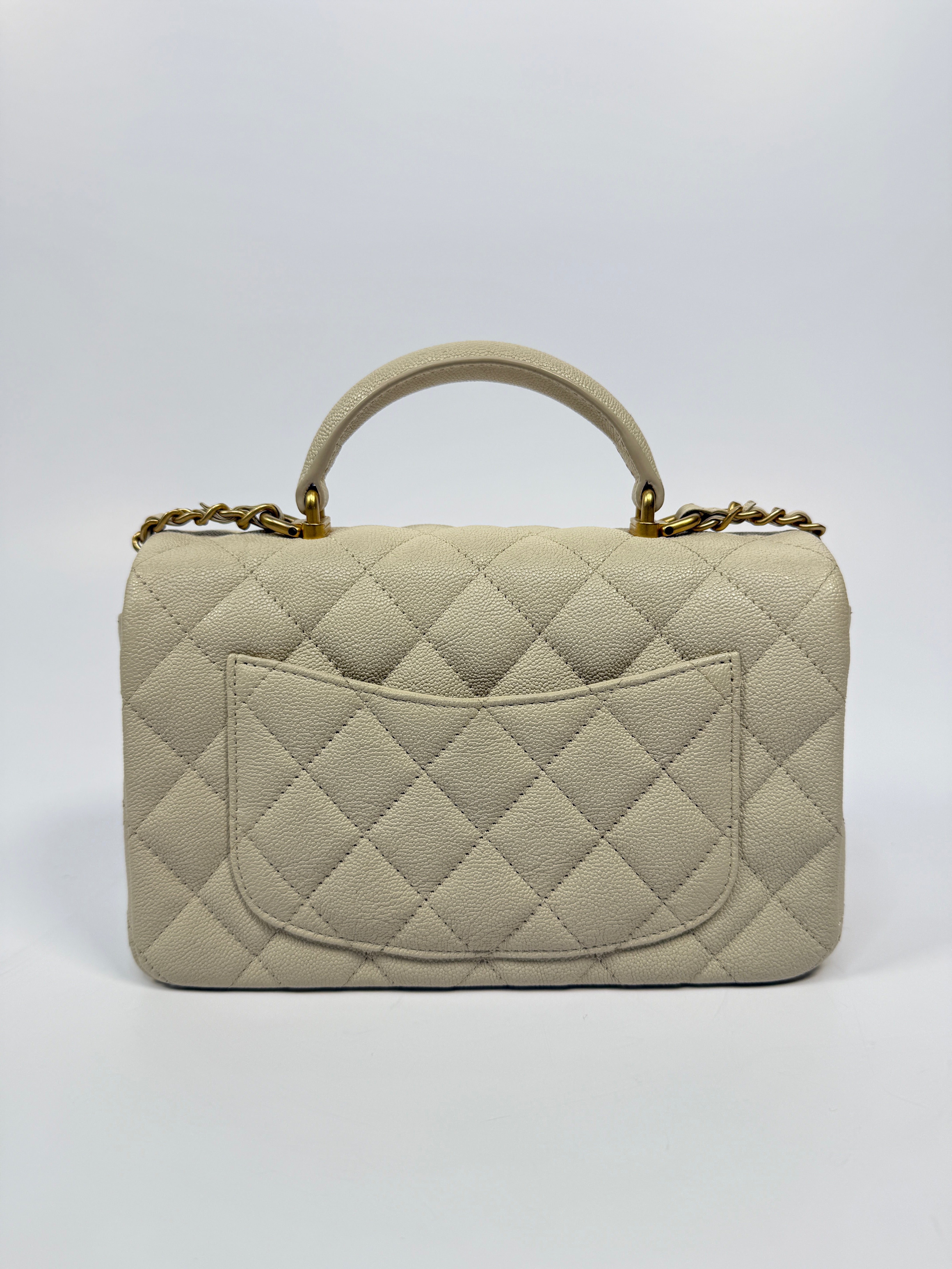 Chanel Mini Rectangle Top Handle In Ecru Caviar With Gold hardware, authentic and preloved in excellent condition