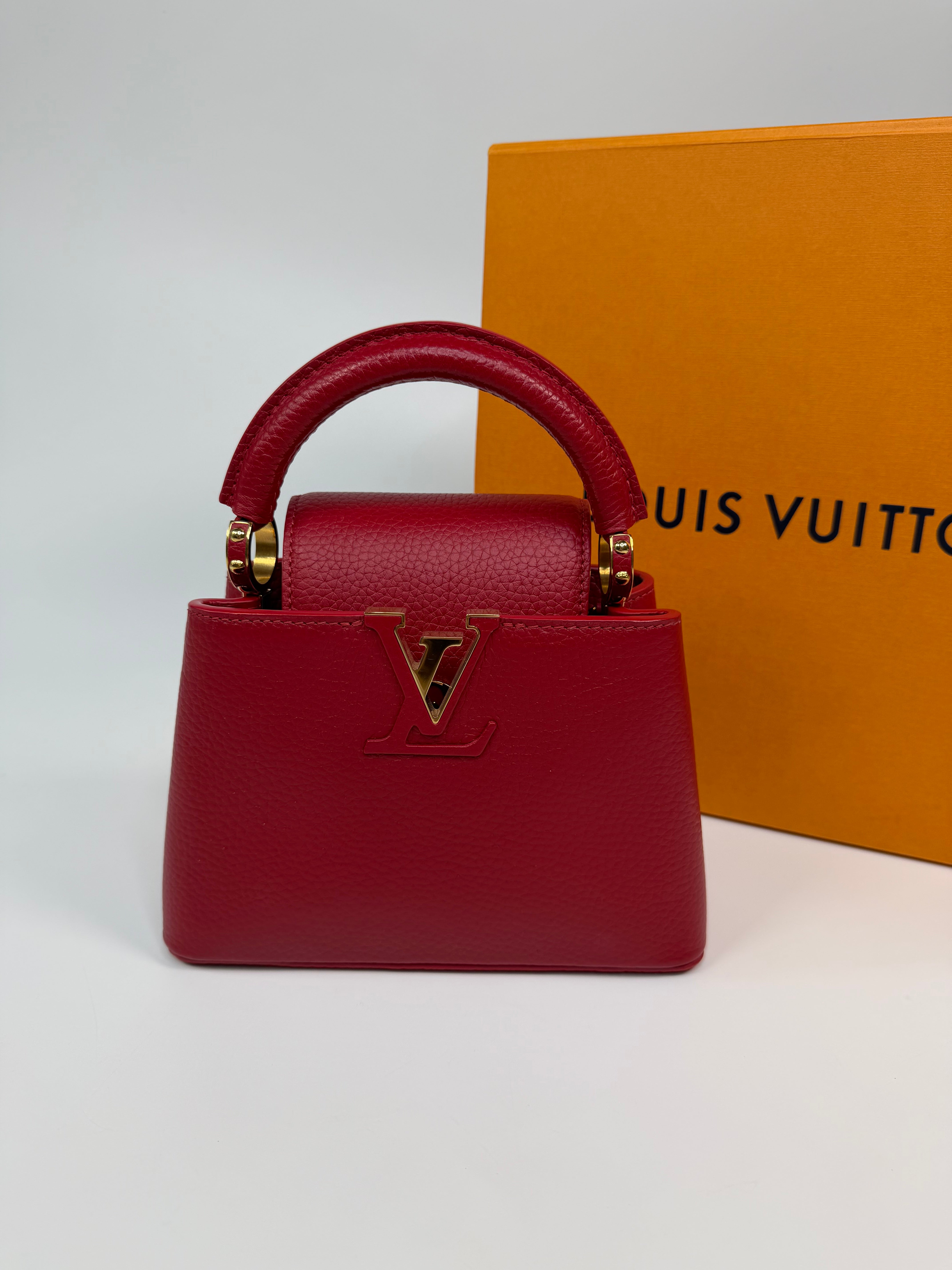 Louis Vuitton Capucines BB Bag In Scarlet Taurillion Leather With Gold Hardware. Authentic and preloved in excellent condition
