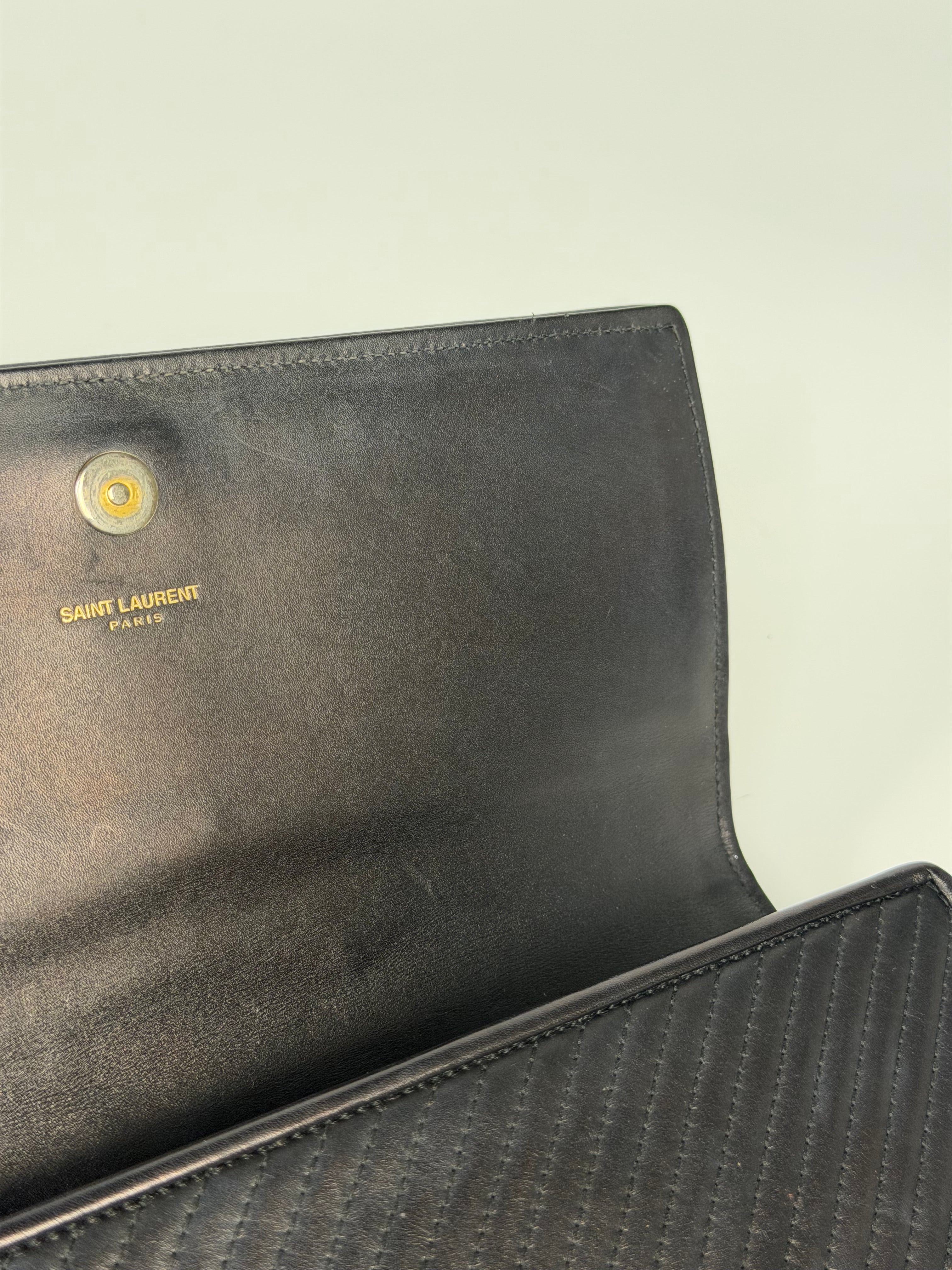 Saint Laurent Kate Long Clutch In Black Leather Gold Hardware. 100% authentic and preloved in very good condition
