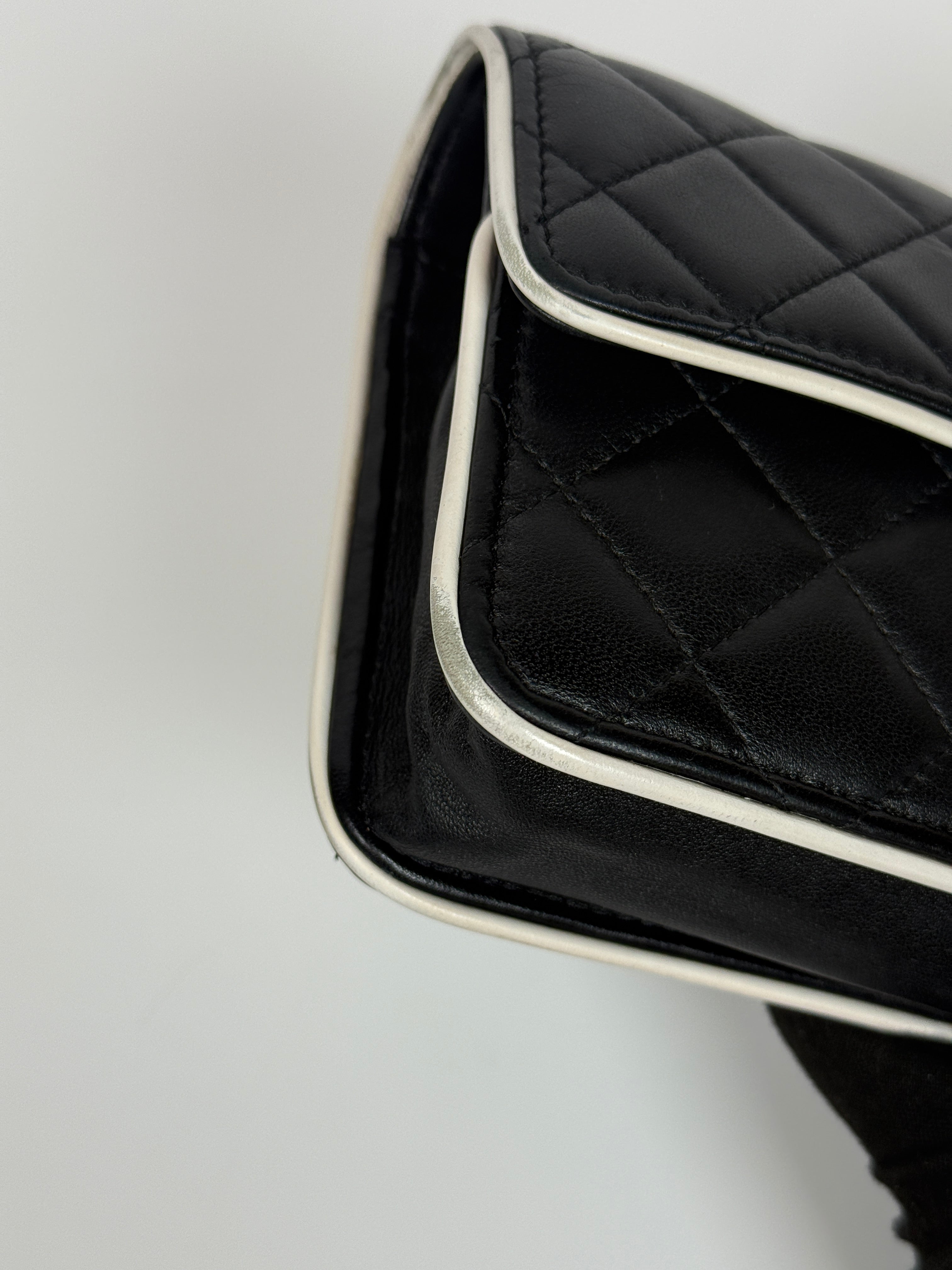 Authentic and preloved Chanel Wallet On Chain In Black & White Lambskin Leather With Pale Gold Hardware. Very Good Condition. 100% Authenticity Guarantee