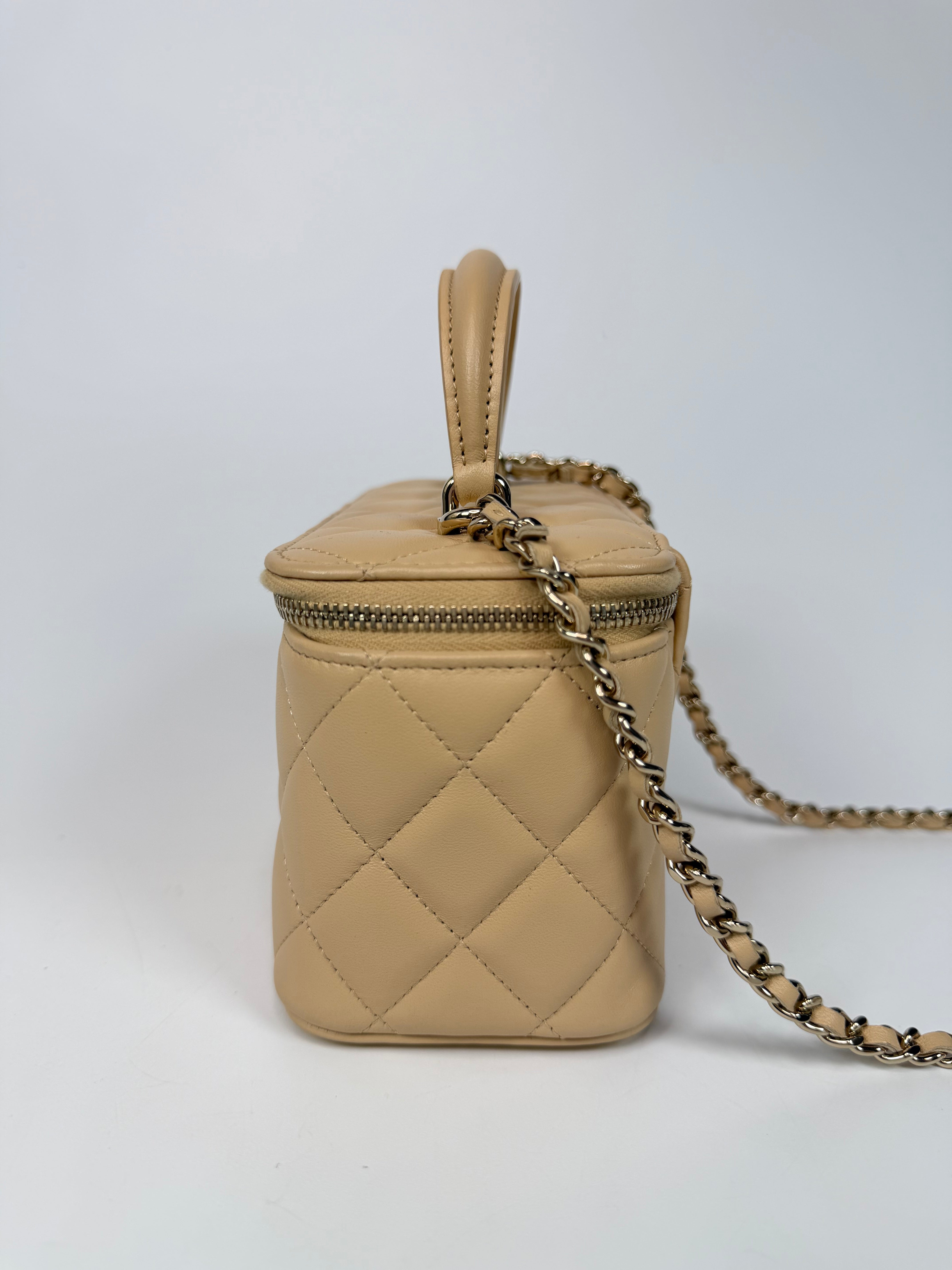 Chanel Mini Vanity Top Handle In Light Beige Lambskin Leather With Gold Hardware. Authentic and preloved in excellent condition. Insured next day delivery. Verified by Luxe Cheshire