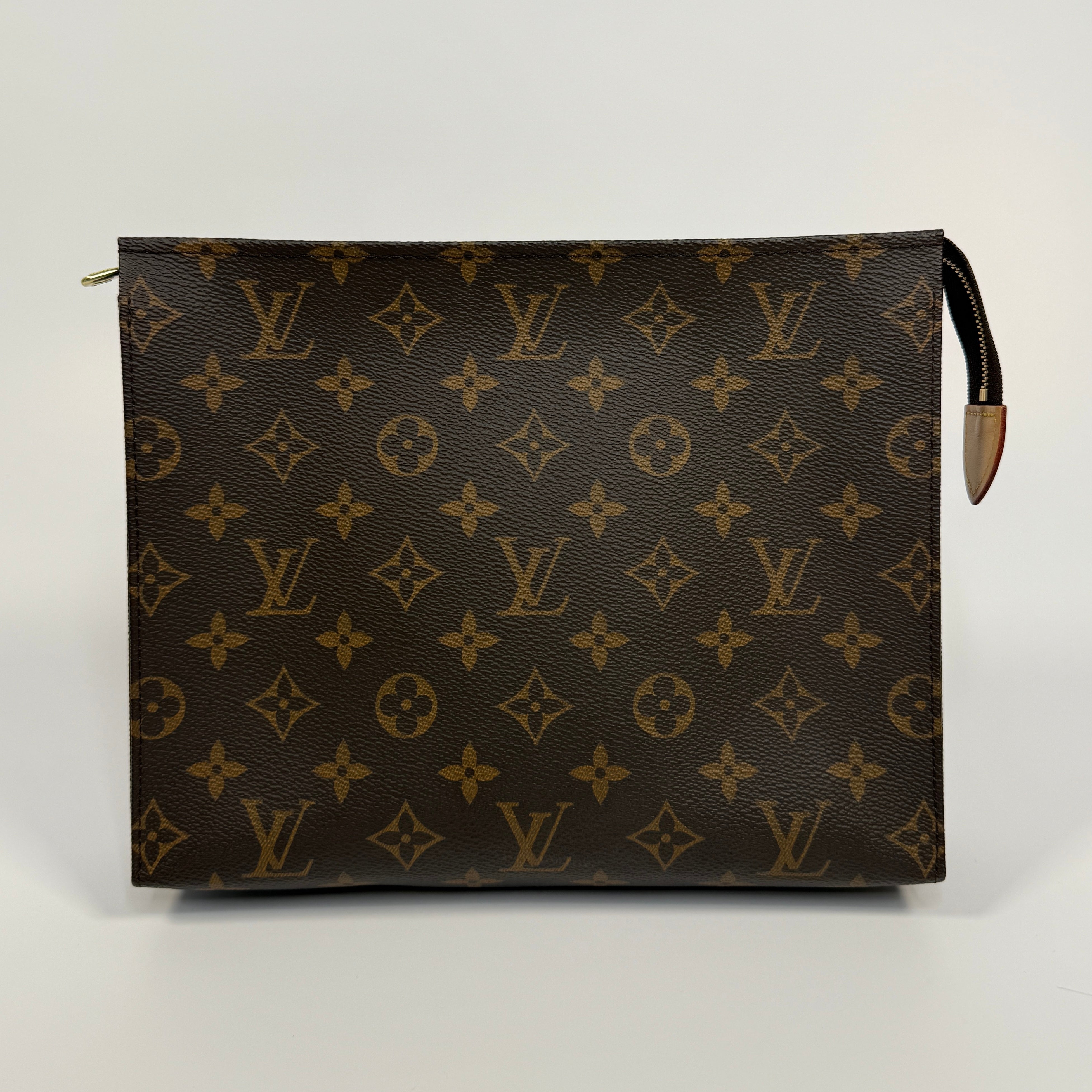 Authentic and preloved Louis Vuitton Monogram Toiletry 26 Pouch In Brown Monogram With Gold Hardware in excellent condition