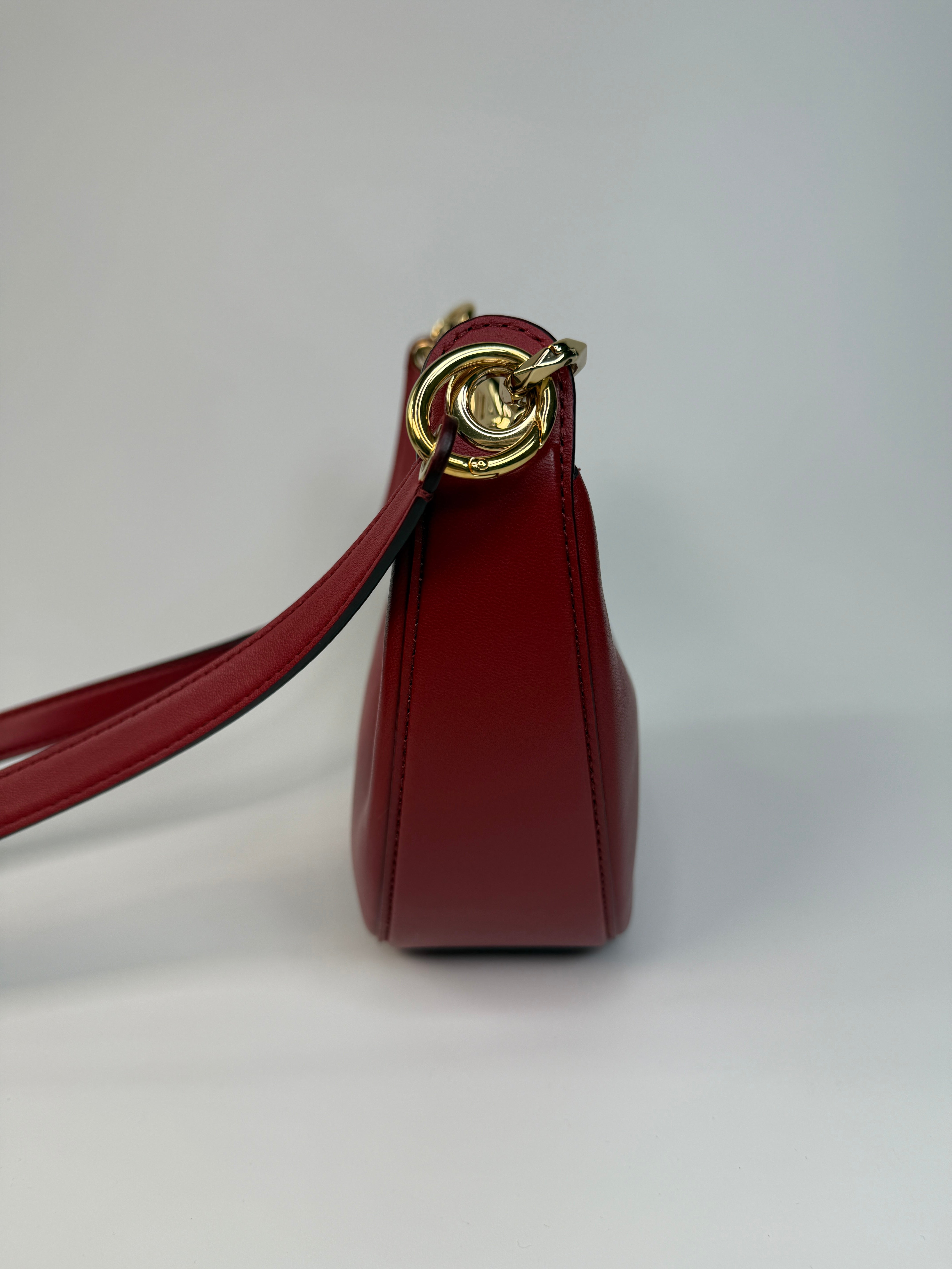 Authentic and preloved Valentino Garavani VLOGO Half Moon Bag In Red Leather With Gold Hardware
